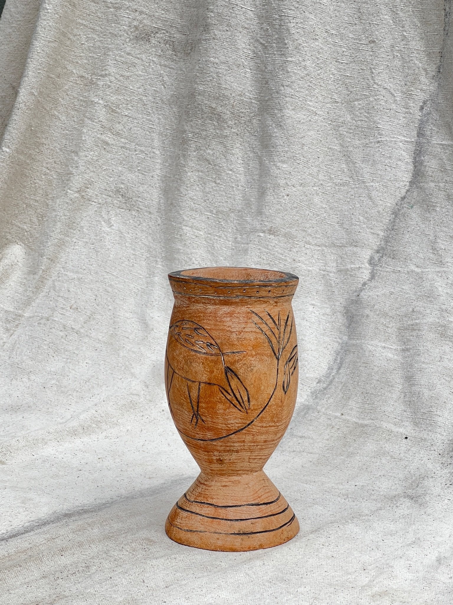 Pair of Vintage Wooden Goblets with Hand Carved Primitive Illustrations, showcasing intricate engravings. hommes + gardens estudio