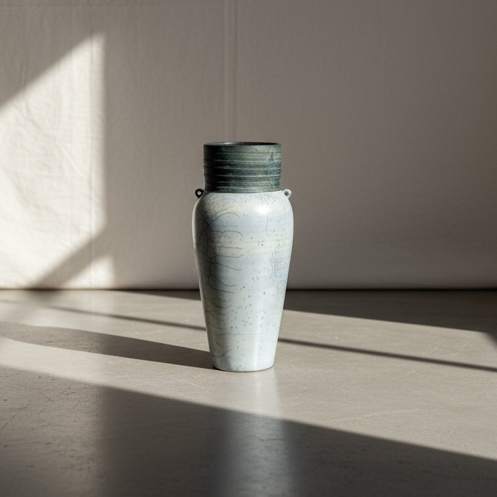 Raku handcrafted ceramic vase with crackled glaze, ribbed rim, and loop handles, featuring a drainage hole and artist’s signature, a unique Japanese-inspired pottery piece — Hommes and Gardens, Pots + Vessels Collection, Home Decor, Landscape Architect, Interior Designer, Outdoor Living, Outdoor Decorations, Home Design, Luxury Design, Art, Furniture, Objects, Best Gifts, Nature, Backyard, Yard.