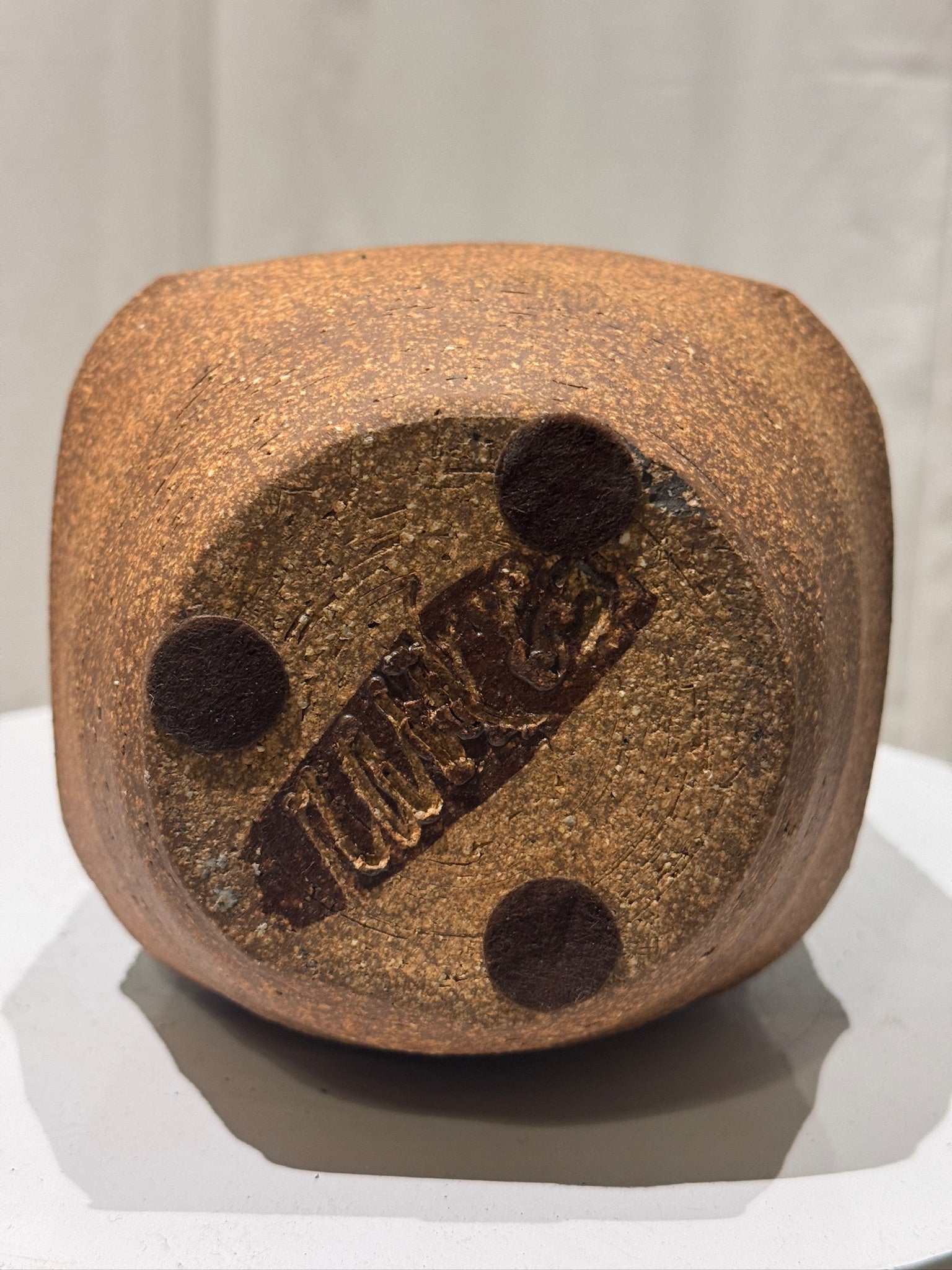 Bottom view of a Rare Mid-Century Modern Raul Coronel Studio Pottery Vase, Signed & Dated 1963 showcasing the signature and texture, hommes + gardens estudio.
