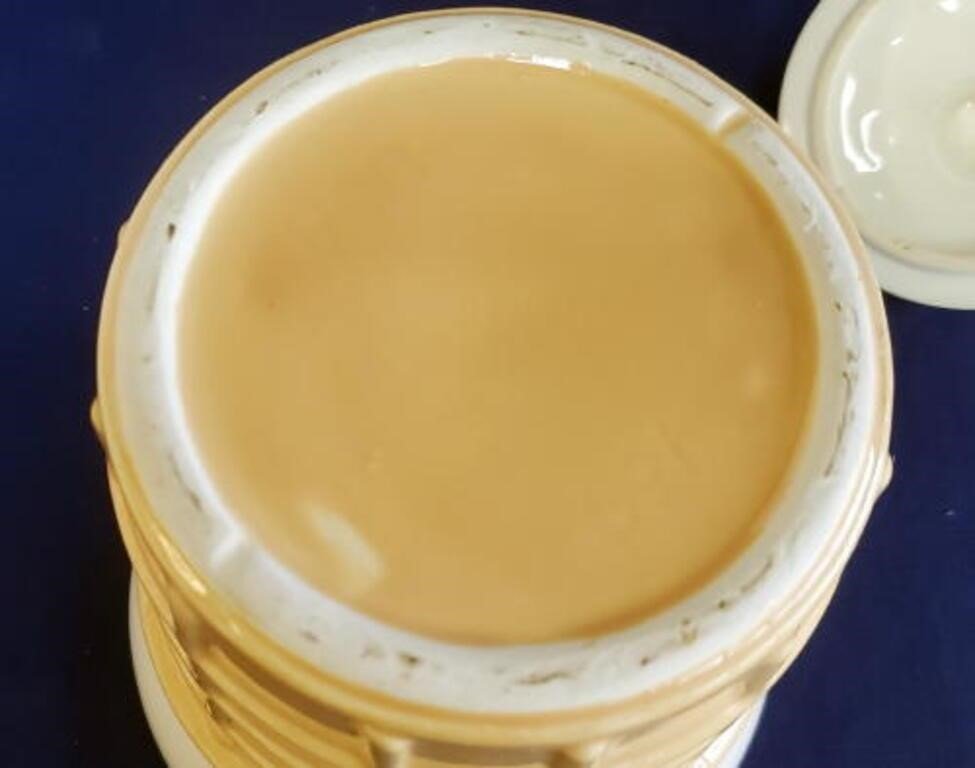 Top view of the lid of a Vintage McCoy Ice Cream Cone Cookie Jar, showcasing its smooth surface and design details. hommes + gardens estudio