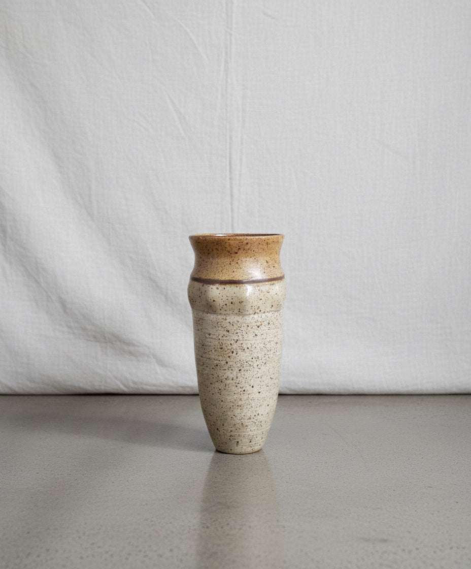 Rustic hand-thrown studio pottery vase in speckled stoneware with artist signature, featuring a natural earthy glaze and organic mid-century form — Hommes and Gardens, Decorative Collection, Landscape Architect, Interior Designer, Outdoor Living, Outdoor Decorations, Home Decor, Home Design, Luxury Design, Art, Furniture, Objects, Best Gifts, Nature, Backyard, Yard.