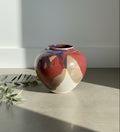 Signed glazed stoneware vase featuring unique abstract painting and bold colors, perfect for floral displays or as art. hommes + gardens estudio.