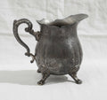Silver Plated Footed Creamer Pitcher showcasing elegant craftsmanship and a classic design. hommes + gardens estudio