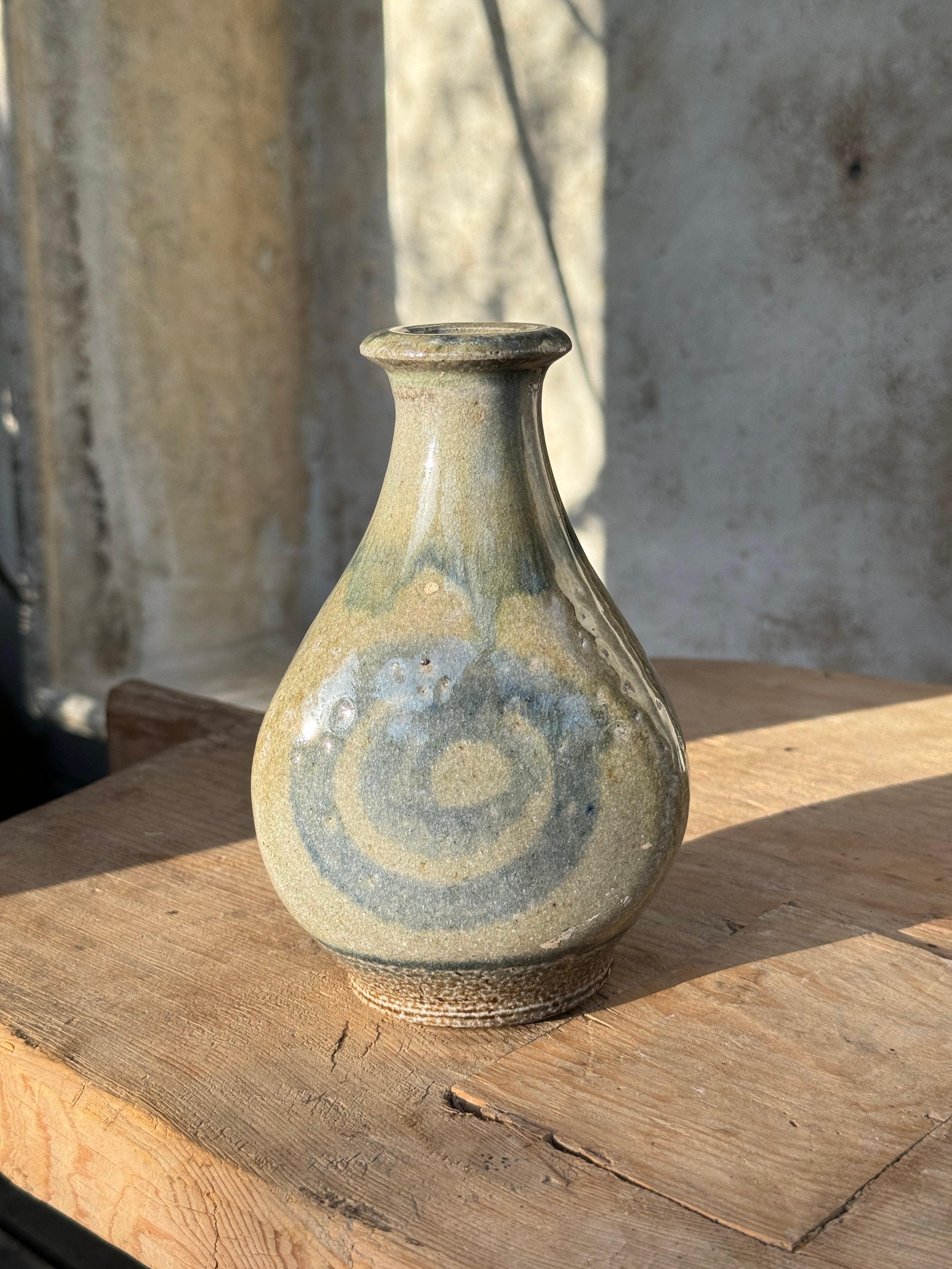 Vintage Glazed Spiral Studio Art Pottery Vase with unique spiral design and gray hues, perfect for decor. hommes + gardens estudio.