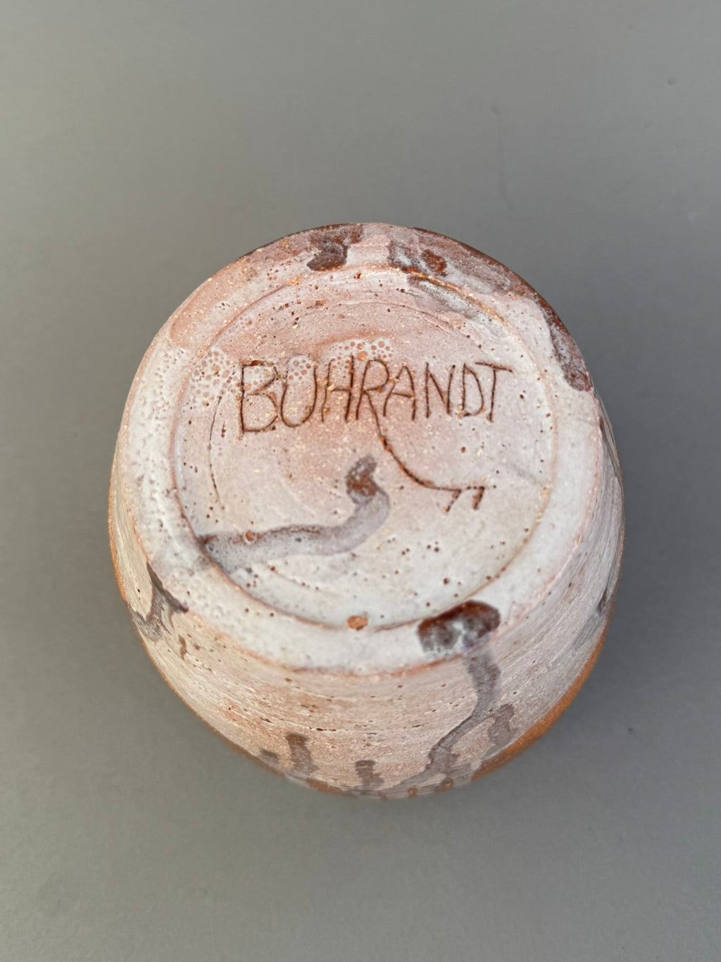 Bottom view of a Signed Buhrandt Studio Art Pottery Cup – Handcrafted Abstract Glazed Stoneware Vessel showcasing the artist's signature. hommes + gardens estudio.