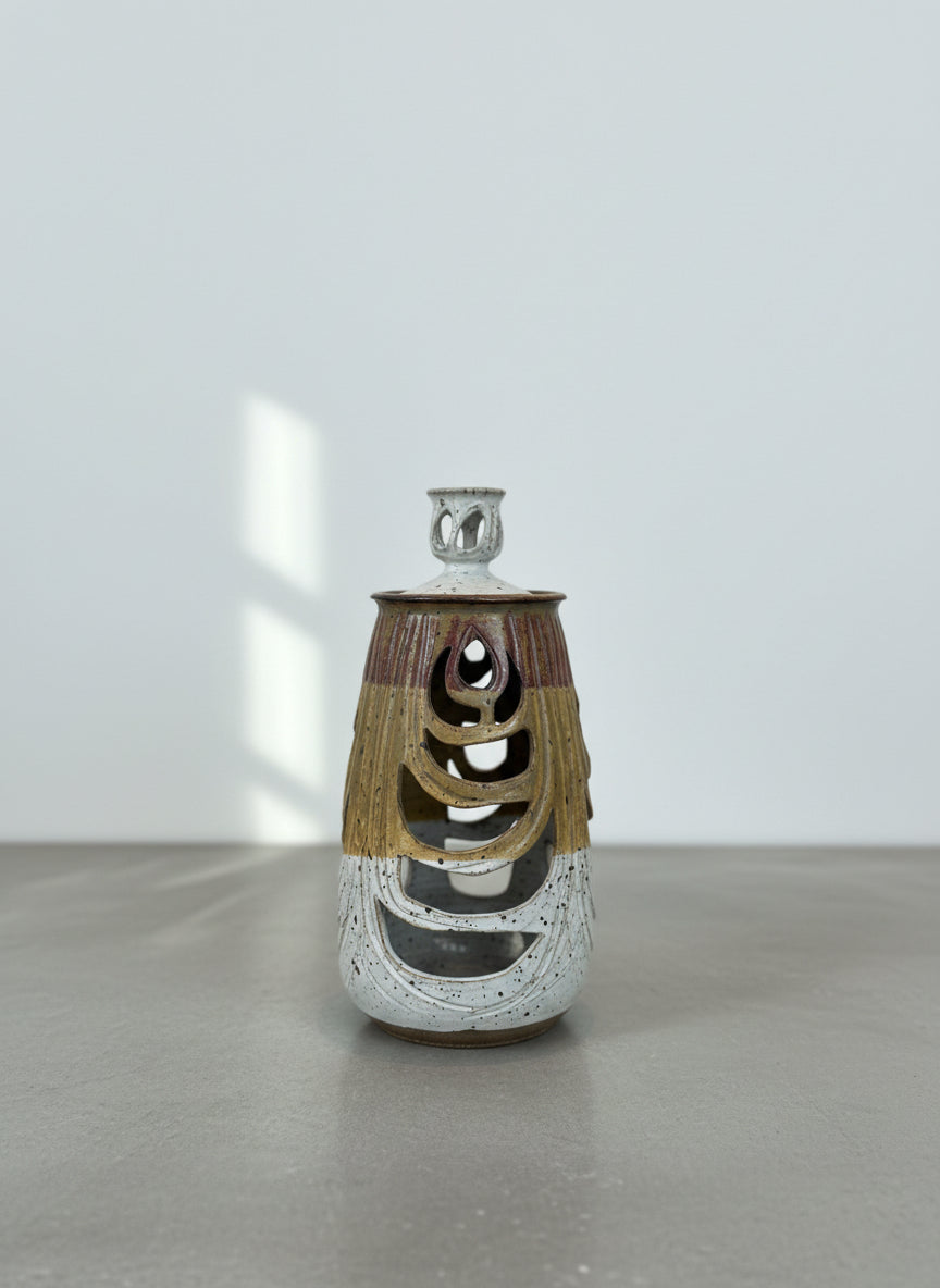 Sculptural Studio Pottery Vase with Lid and Organic Cutouts showcasing intricate design and layered glazes, hommes + gardens estudio.