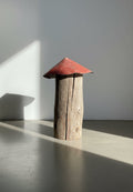 Rustic Handmade Mushroom Sculpture – Tall Weathered Log Stem with Red Metal Cap, showcasing aged wood and a red-painted cap. hommes + gardens estudio.