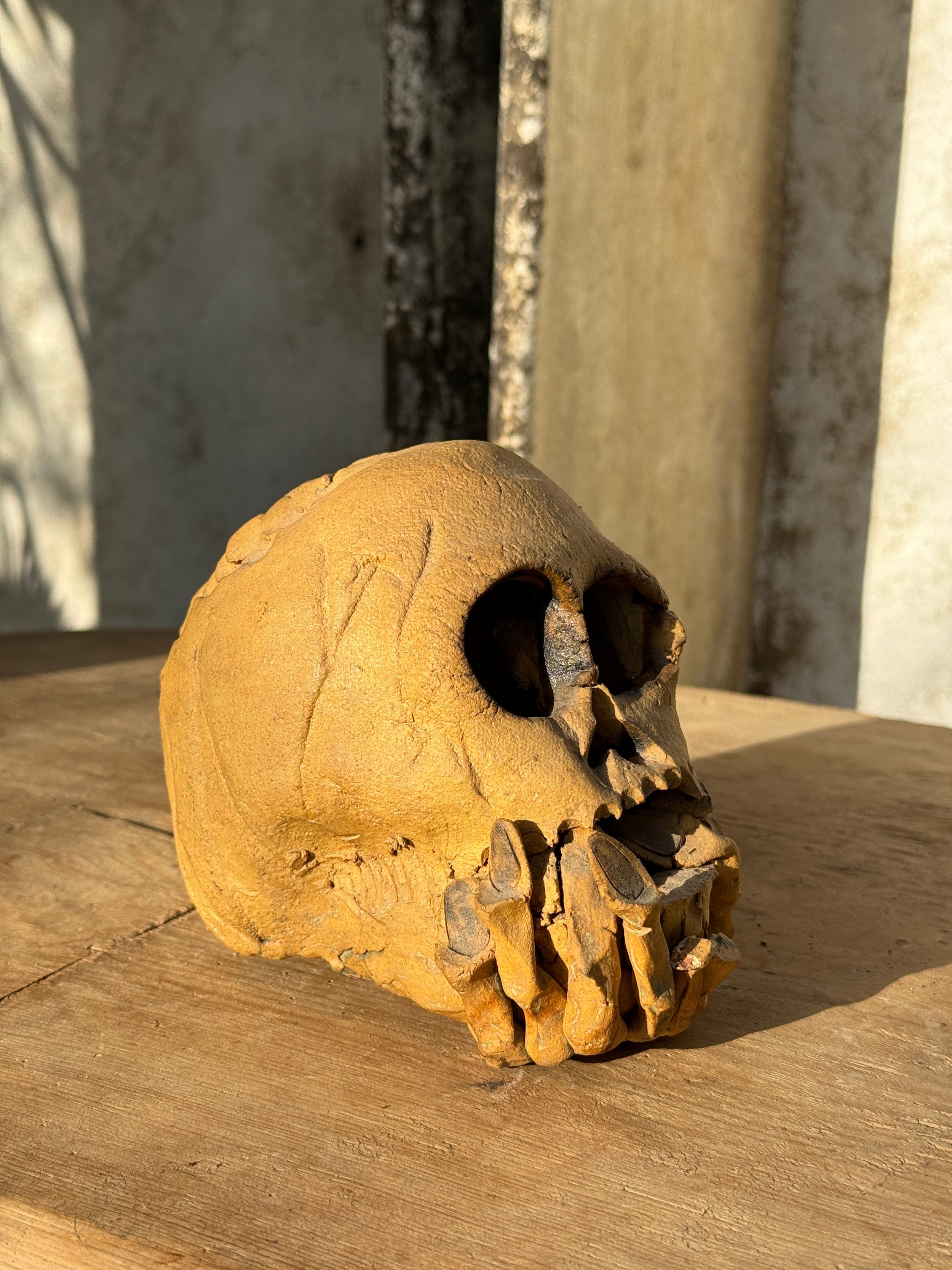 Unique handmade ceramic skull candle holder with intricate sculptural details, a bold and collectible decorative piece — Hommes and Gardens, home decor, outdoor decorations, home design, luxury design, Landscape Architect, Interior Designer, Outdoor Living, Art, Furniture, Objects, Best Gifts, Nature, Backyard, Yard.
