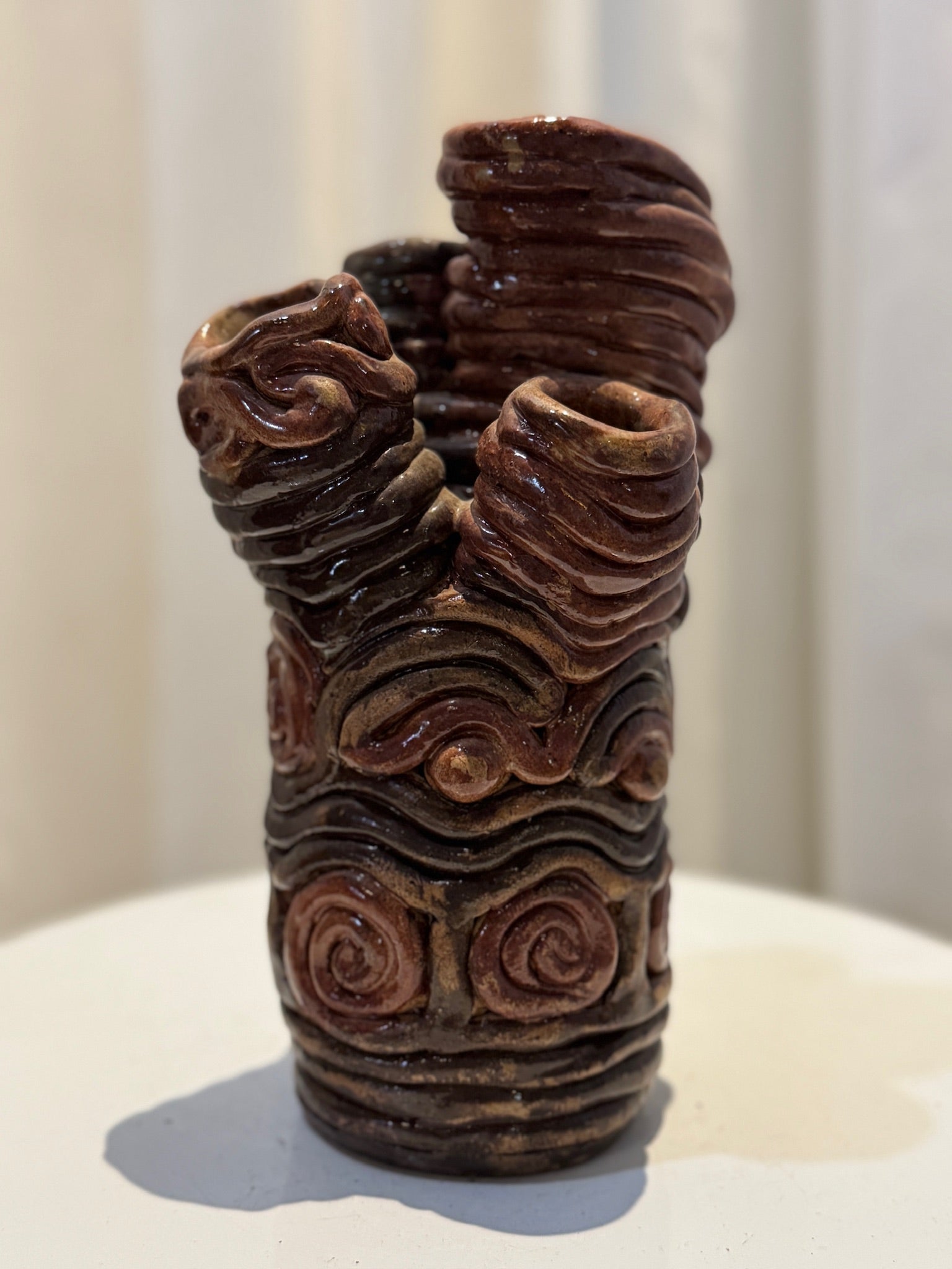 Unique handcrafted clay swirl sculptural vase with four openings, organic freeform ceramic art piece featuring earthy brown and black glaze tones — Hommes and Gardens, Vases + Vessels Collection, Landscape Architect, Interior Designer, Outdoor Living, Art, Furniture, Objects, Best Gifts, Nature, Backyard, Yard, Outdoor Decorations, Home Decor, Home Design, Luxury Design.