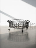 Victorian Oval Wrought Iron Plant Holder with elegant scrollwork, a classic design, and natural patina. hommes + gardens estudio.