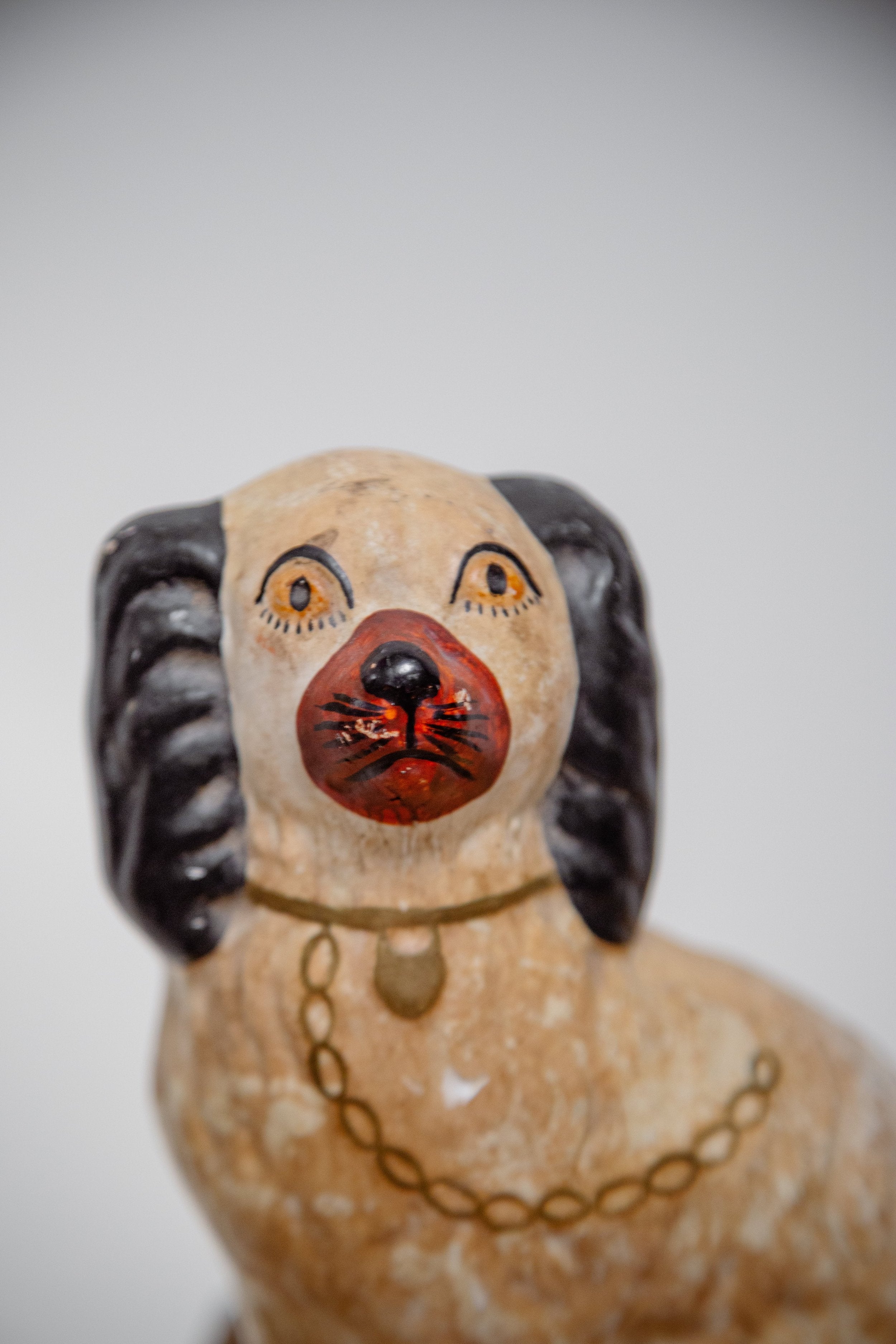 Close-up of a Victorian Pair of Staffordshire Dog Figurines showcasing intricate details and craftsmanship, hommes + gardens estudio.