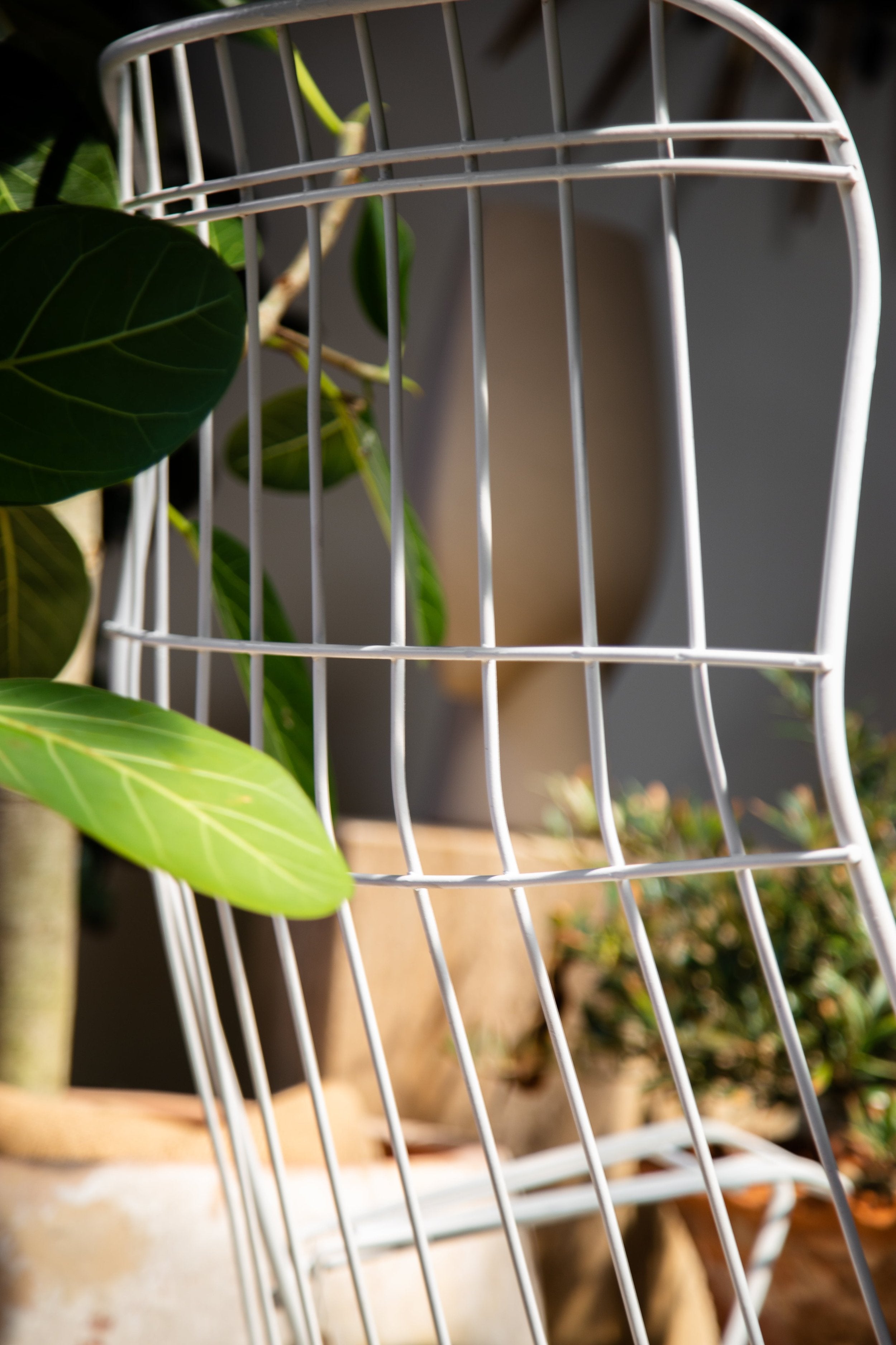 Detail of a Pair of Mid-Century Modern Homecrest Siesta Swivel Rocker Patio Lounge Chairs in white, showcasing sleek design. hommes + gardens estudio.