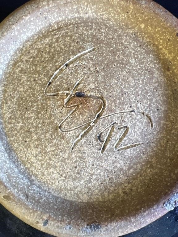 Signature detail on the bottom of a signed glazed stoneware bowl, showcasing unique artistry and craftsmanship. hommes + gardens estudio.