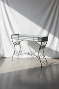 Vintage Arras Style Tall Weathered Metal Plant Stand showcasing elegant design and vintage charm. hommes + gardens estudio.