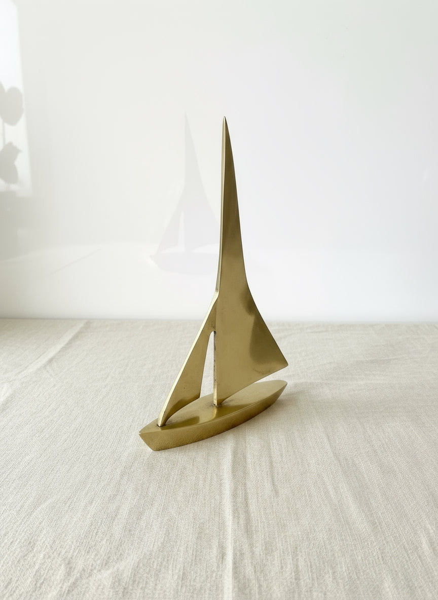 Vintage Paper Weight Brass Metal Sailboat, elegant brass sailboat design for desk decor, practical paperweight for documents. hommes + gardens estudio.