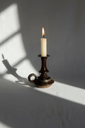 Vintage Brown Ceramic Stoneware Candle Holder with candle and soft shadows, perfect for home decor accents. hommes + gardens estudio.