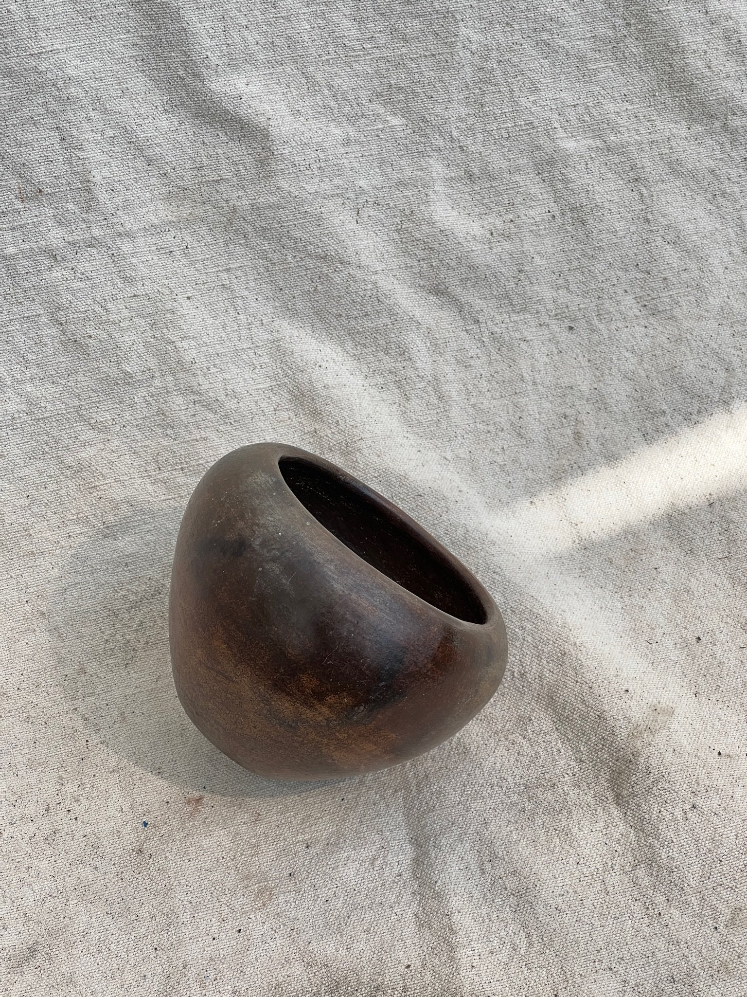 Small Vintage Dark Brown Clay Vase showcasing unique rich brown organic character. Perfect for elegant home decor. hommes + gardens estudio.