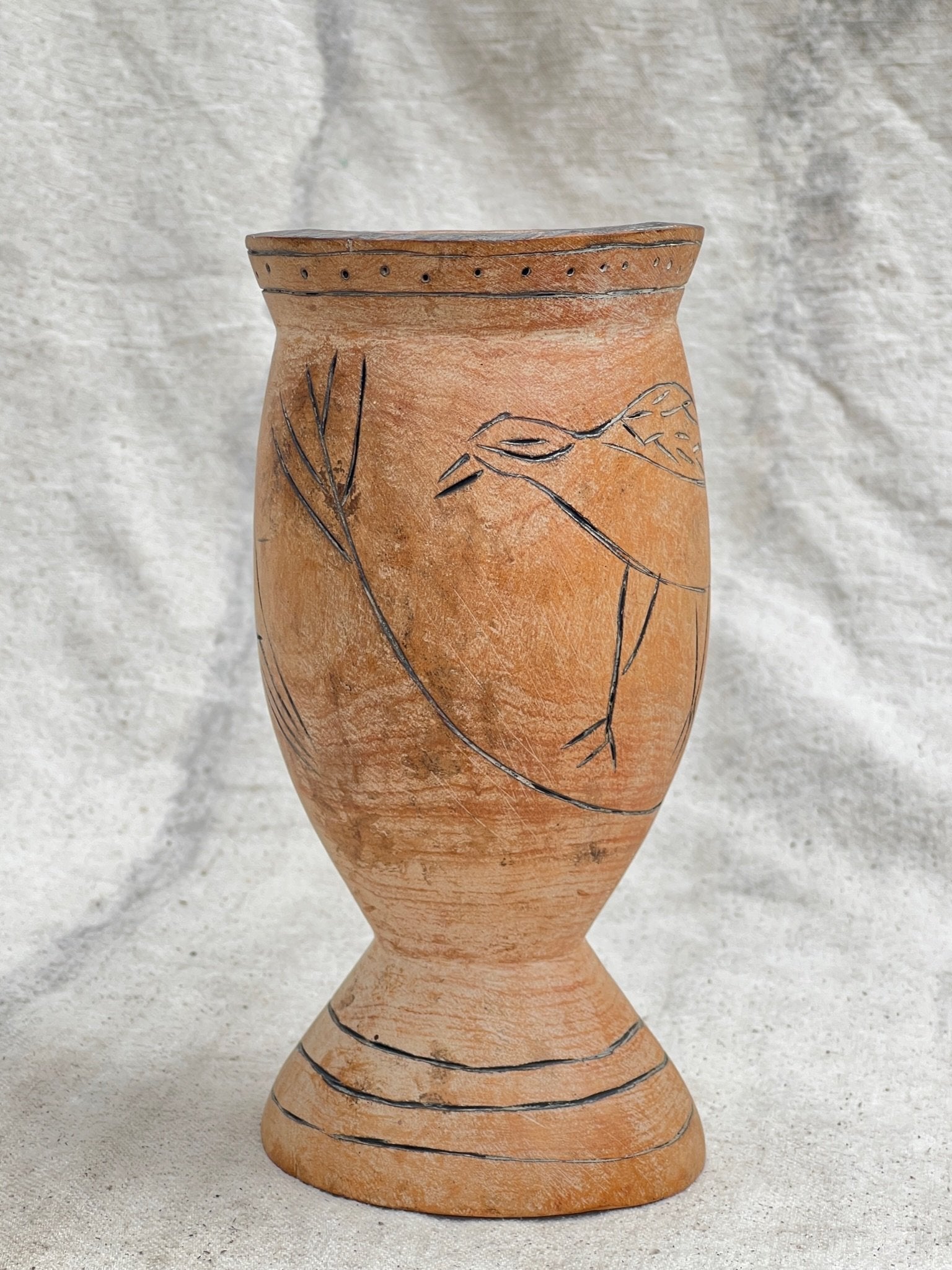 Pair of Vintage Wooden Goblets with Hand Carved Primitive Illustrations featuring engraved bird design on surface. hommes + gardens estudio.