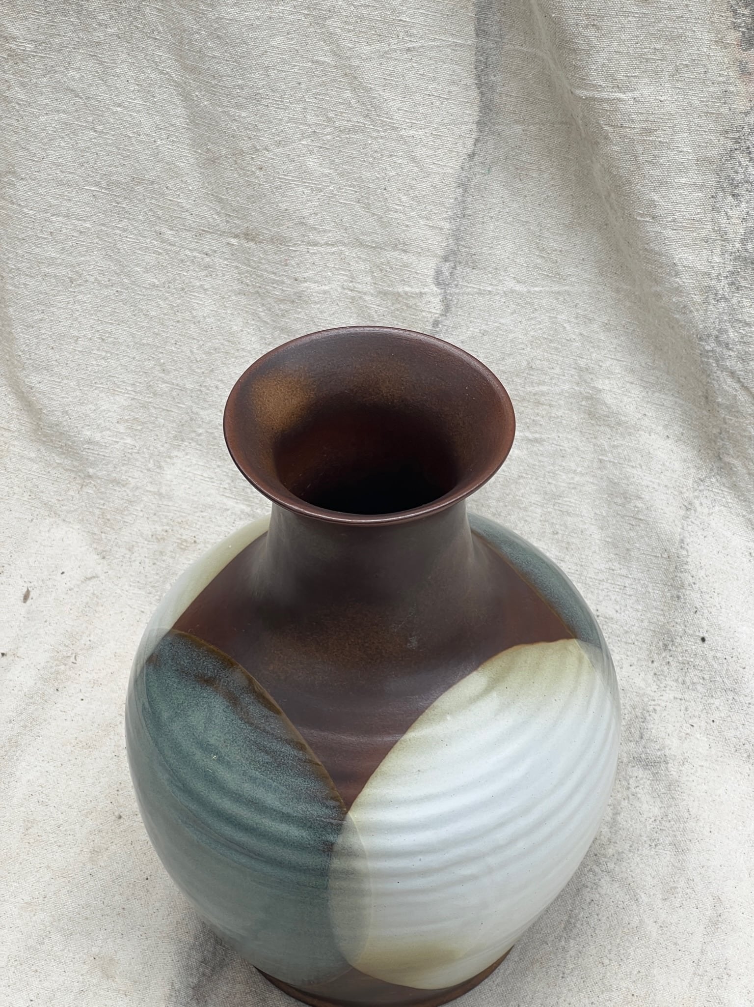 Vintage Pottery Craft Ceramic Drip Glaze Vase featuring muted abstract shapes in brown, antique white, and livid blue. hommes + gardens estudio.