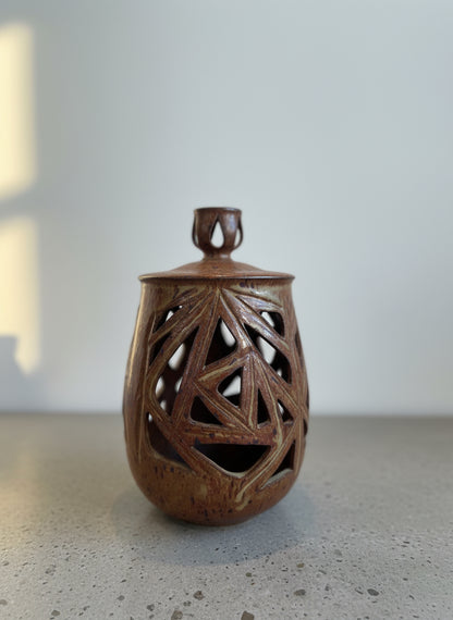 Vintage ceramic vase with lid and geometric cutout design, mid-century-inspired form with speckled brown glaze, side angle — Hommes and Gardens, Home Decor Collection, landscape design, plant design, Landscape Architect, Interior Designer, Outdoor Living, Outdoor Decorations, Home Design, Luxury Design, Art, Furniture, Objects, Best Gifts, Nature, Backyard, Yard.