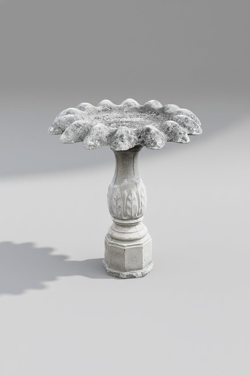 Vintage concrete flower-petal birdbath on fluted pedestal with octagonal base, weathered patina, and botanical detailing — Hommes and Gardens, Water Features Collection, Landscape Architect, Interior Designer, Outdoor Living, Outdoor Decorations, Home Decor, Home Design, Luxury Design, Art, Furniture, Objects, Best Gifts, Nature, Backyard, Yard.