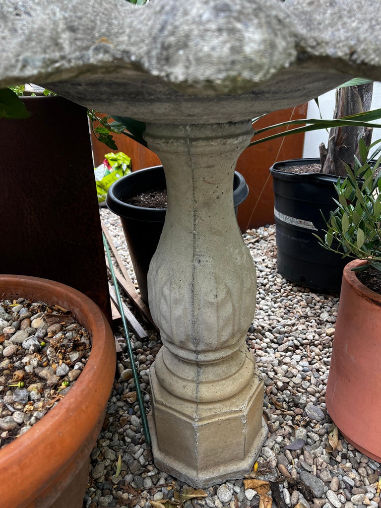 Vintage concrete flower-petal birdbath with fluted pedestal base and weathered patina, elegant classical garden accent — Hommes and Gardens, Water Features Collection, Landscape Architect, Interior Designer, Outdoor Living, Art, Furniture, Objects, Best Gifts, Nature, Backyard, Yard, Outdoor Decorations, Home Decor, Home Design, Luxury Design.