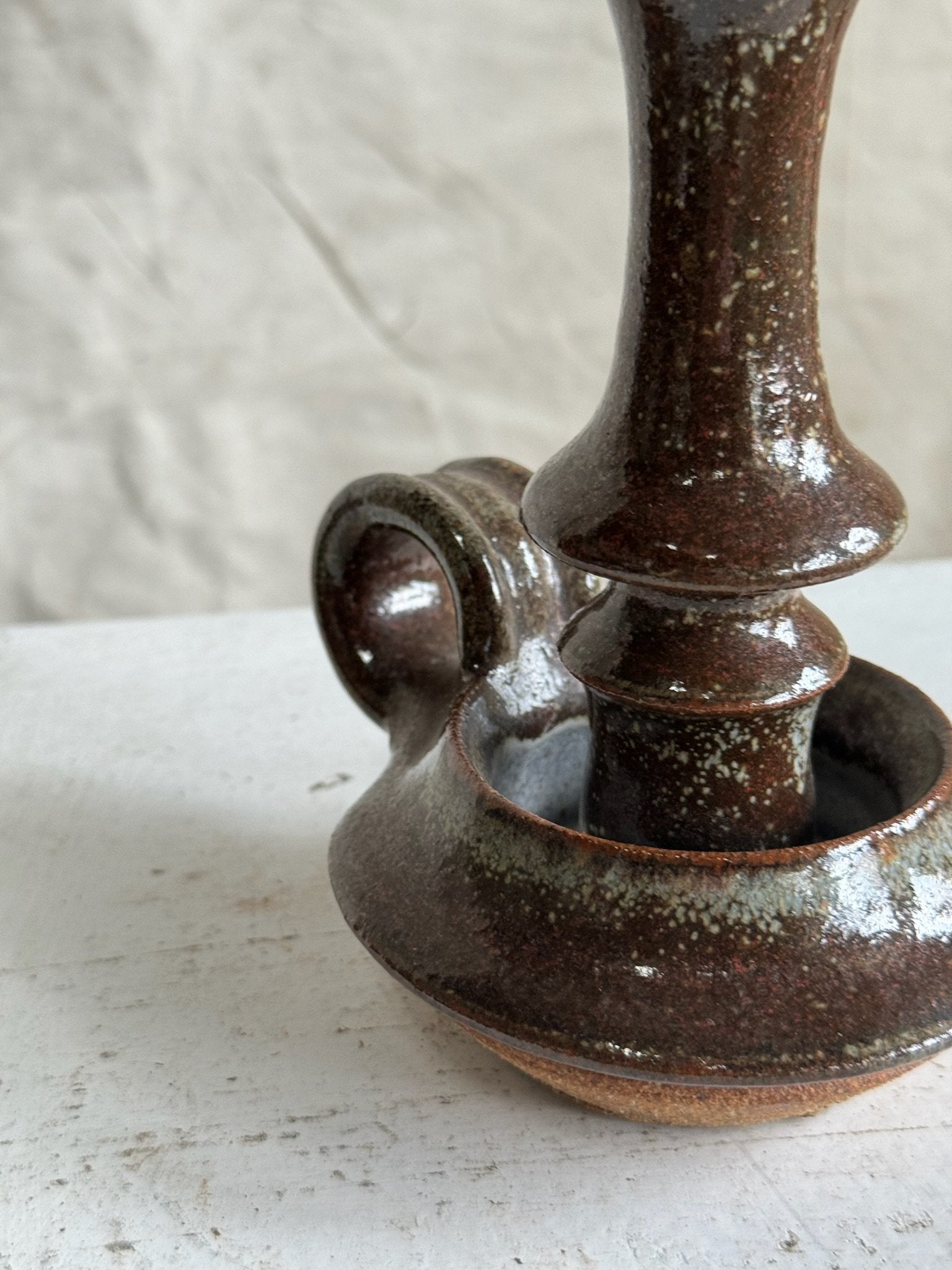 Vintage Brown Ceramic Stoneware Candle Holder featuring rich dark brown hue and timeless design. hommes + gardens estudio.