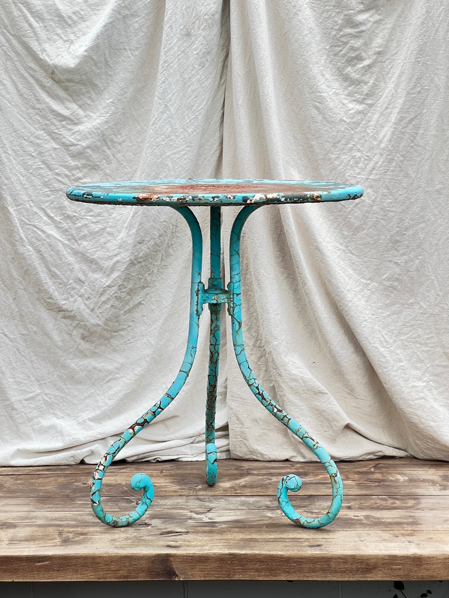 Vintage French Turquoise Rusted Bistro Table with elegant base and patina, perfect for timeless decor. hommes + gardens estudio.