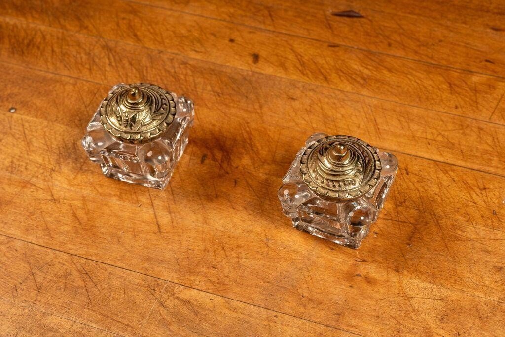 Vintage glass tealight holders, set of two with golden lids, offering elegant candlelight décor for modern or traditional interiors — Hommes and Gardens, Smoke + Fire Collection, Home Decor, Outdoor Decorations, Landscape Architect, Interior Designer, Outdoor Living, Home Design, Luxury Design, Art, Furniture, Objects, Best Gifts, Nature, Backyard, Yard.