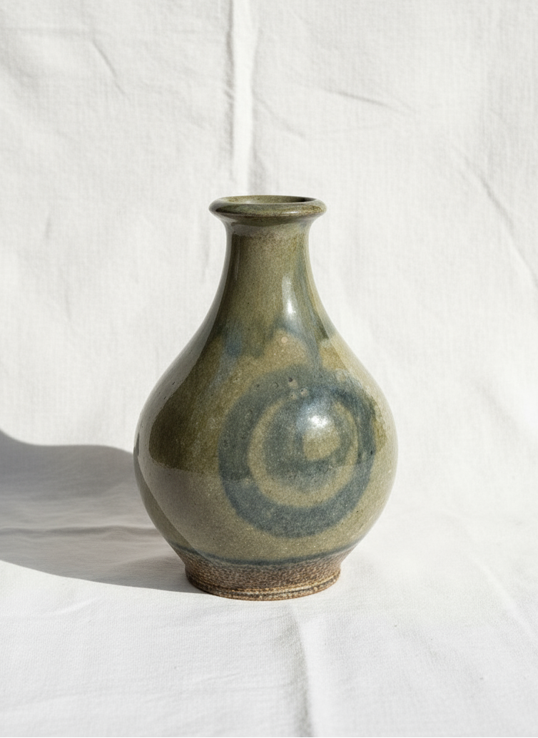 Vintage Glazed Spiral Studio Art Pottery Vase showcasing unique spiral design and gray hue, artisanship by hommes + gardens estudio.
