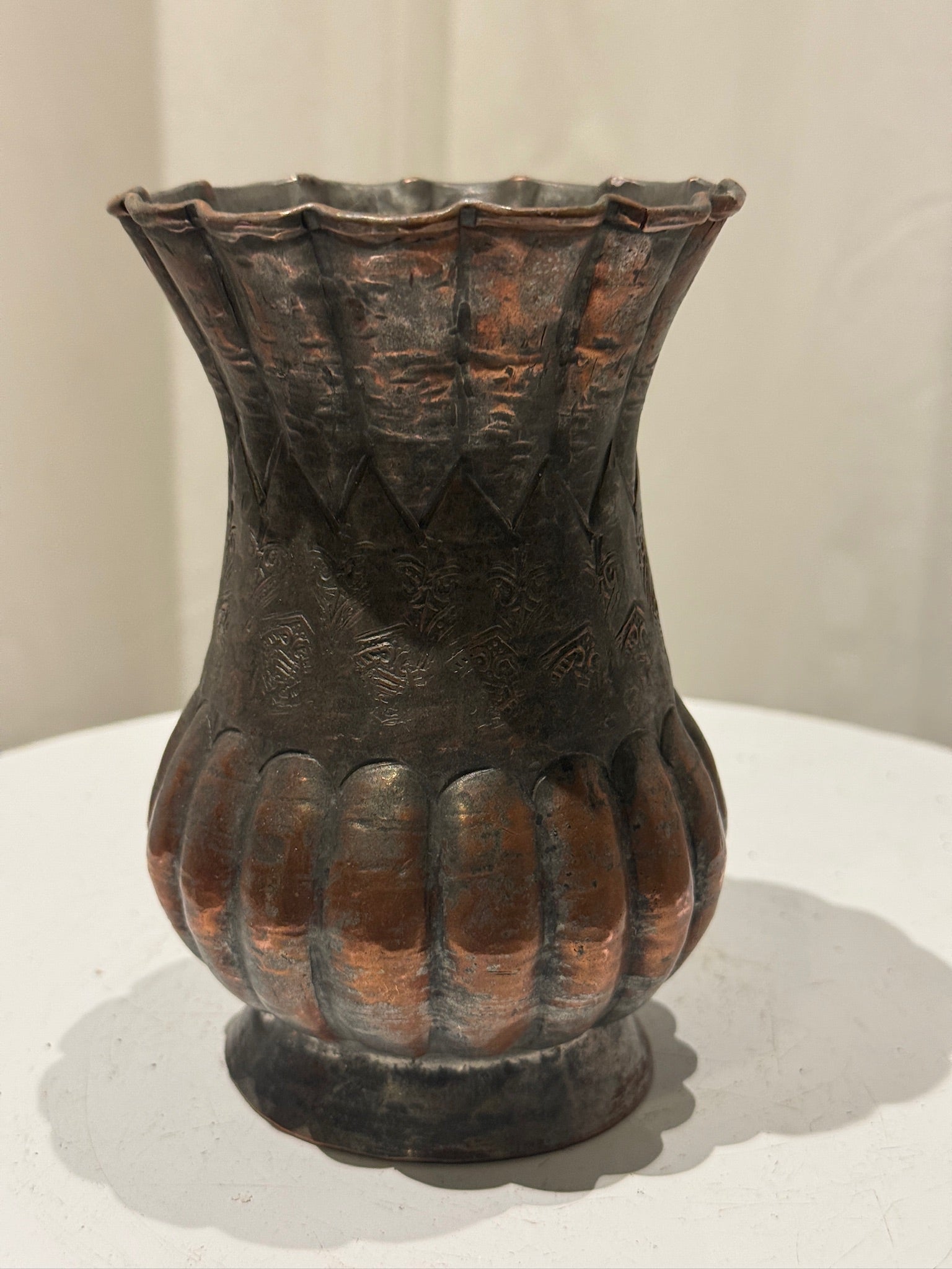 Vintage handcrafted Egyptian copper vase with intricate geometric and floral engravings, scalloped rim, and aged patina, showcasing traditional Middle Eastern metalwork — Hommes and Gardens, Vases + Vessels Collection, Landscape Architect, Interior Designer, Outdoor Living, Art, Furniture, Objects, Best Gifts, Nature, Backyard, Yard, Outdoor Decorations, Home Decor, Home Design, Luxury Design.