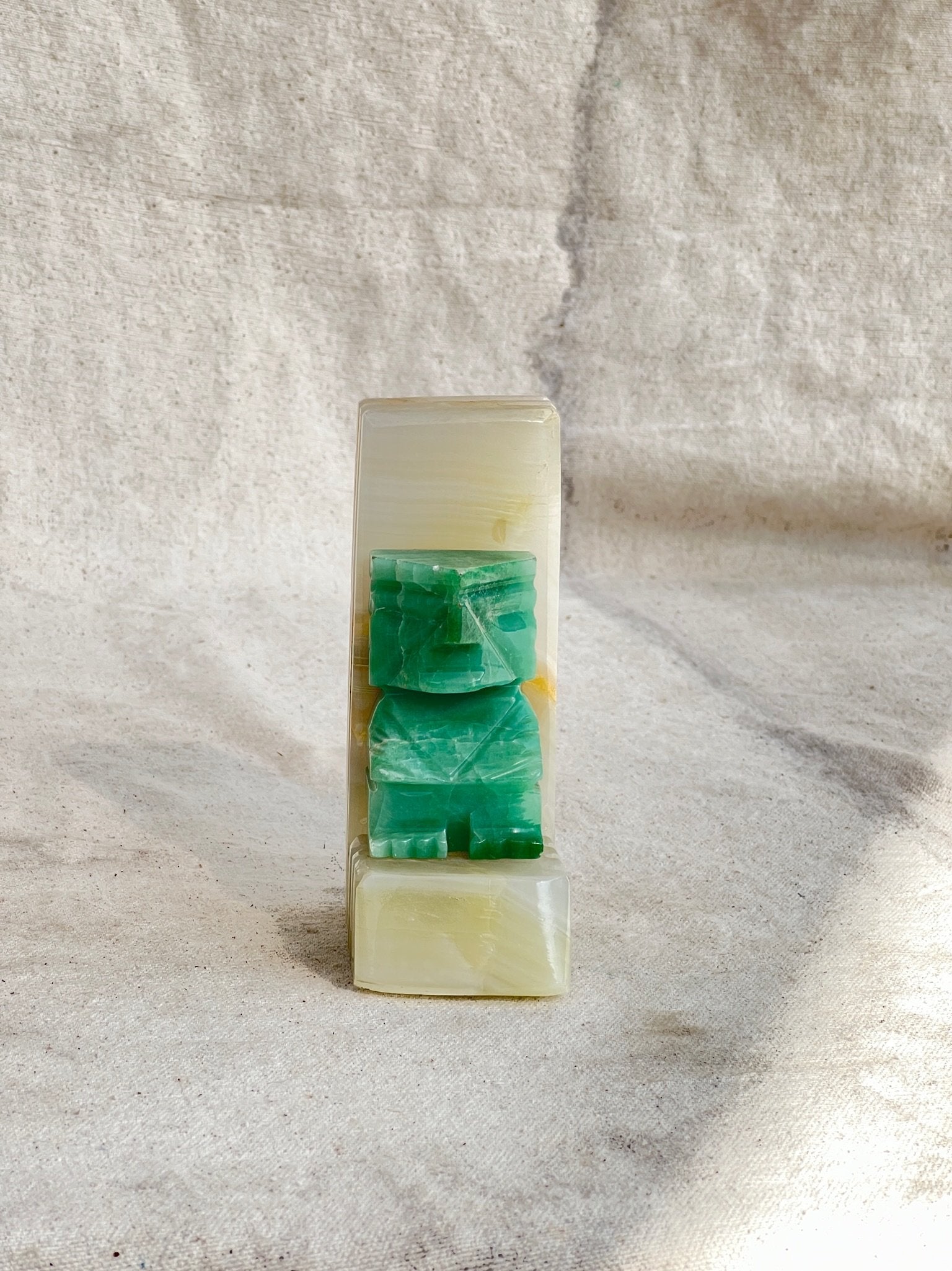 Carved Onyx Stone Bookend (Single) showcasing elegant design and natural green hues, perfect for home decor. hommes + gardens estudio.
