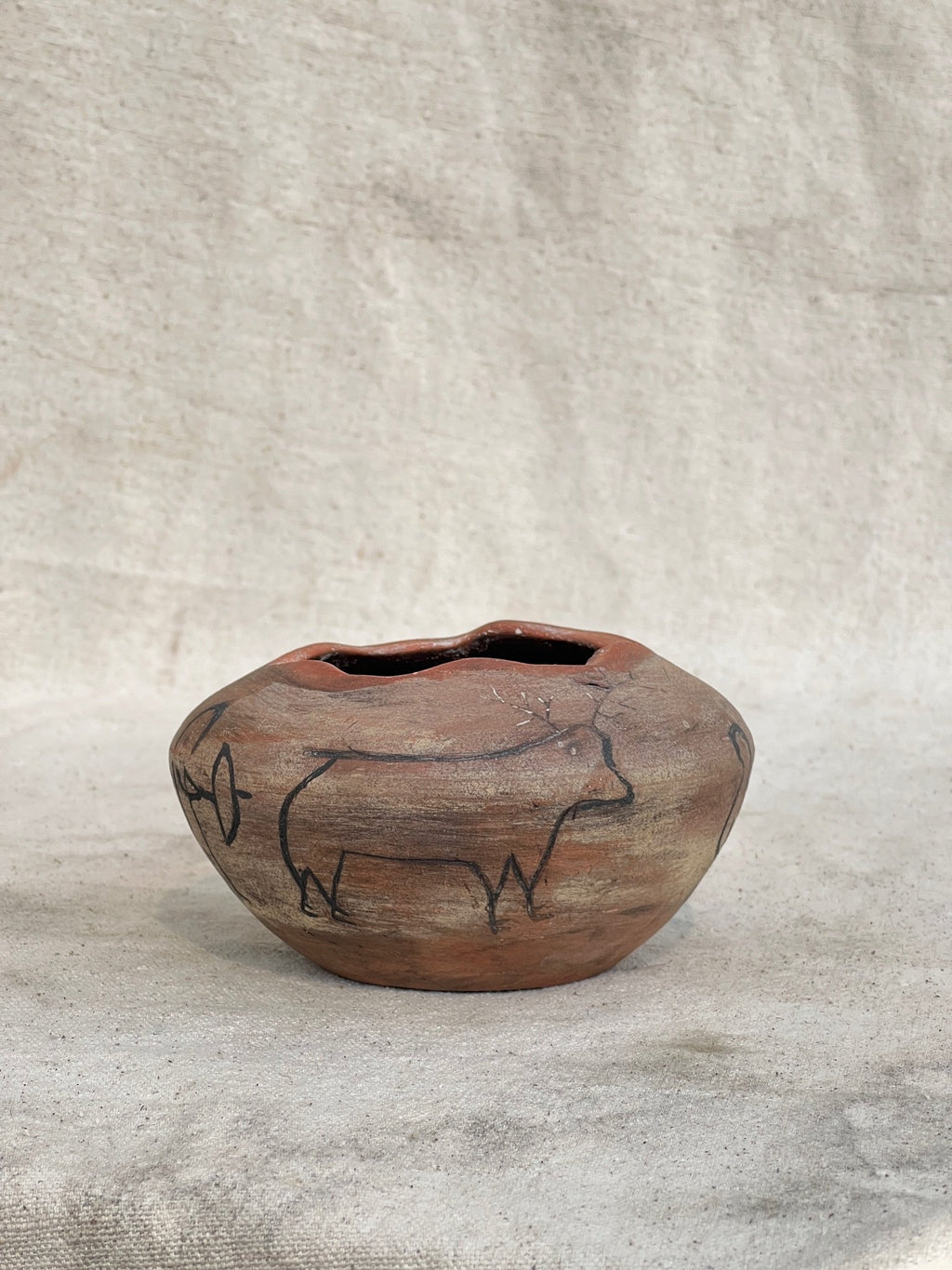 Vintage Clay Vase with Primitive Drawings (Signed) featuring weathered finish and primitive animal art. hommes + gardens estudio