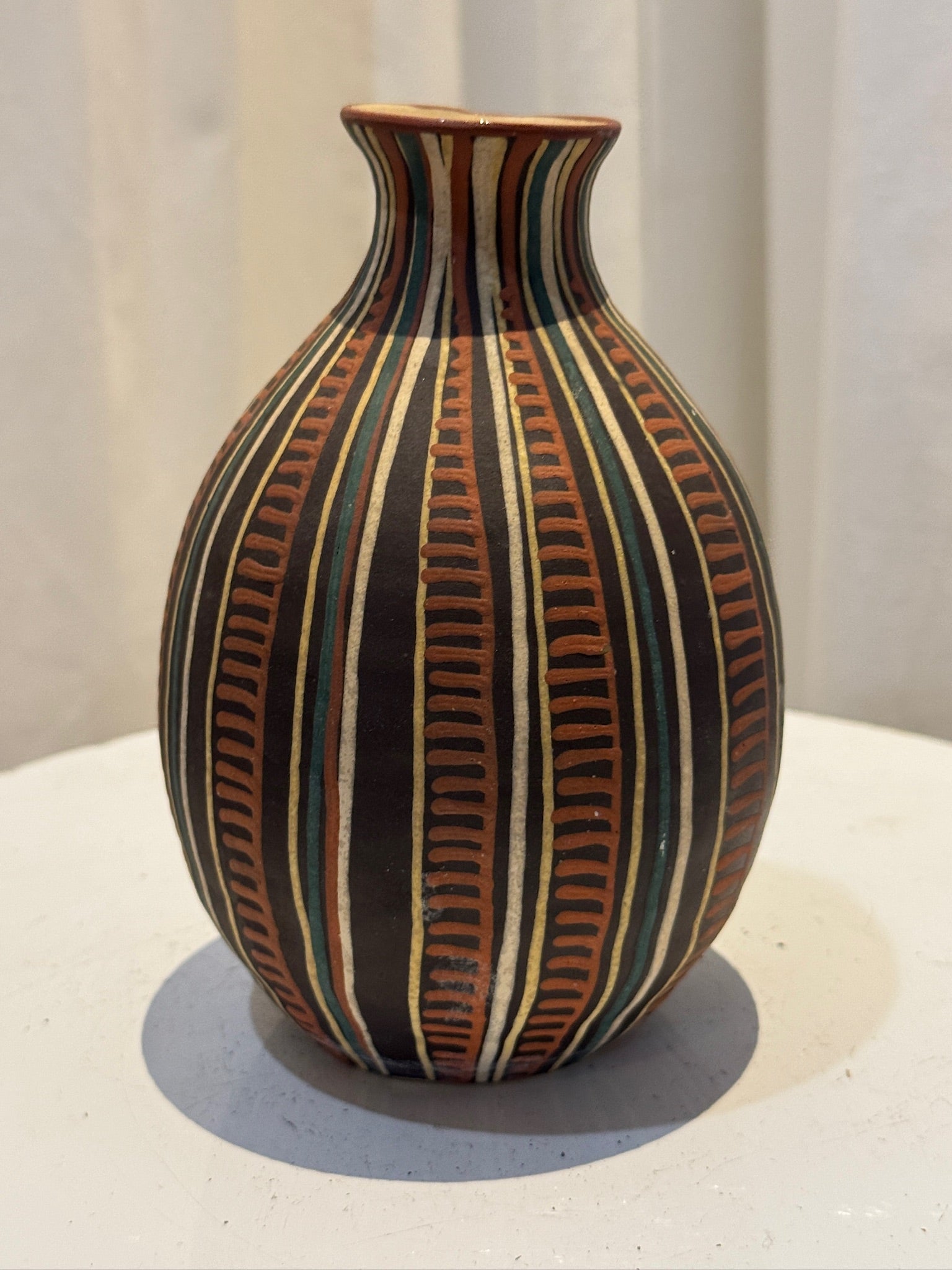 Vintage handcrafted tribal-inspired ceramic vase with hand-painted geometric motifs in earthy black, terracotta, and neutral tones, a cultural art pottery collectible — Hommes and Gardens, Vases + Vessels Collection, Landscape Architect, Interior Designer, Outdoor Living, Art, Furniture, Objects, Best Gifts, Nature, Backyard, Yard, Outdoor Decorations, Home Decor, Home Design, Luxury Design.