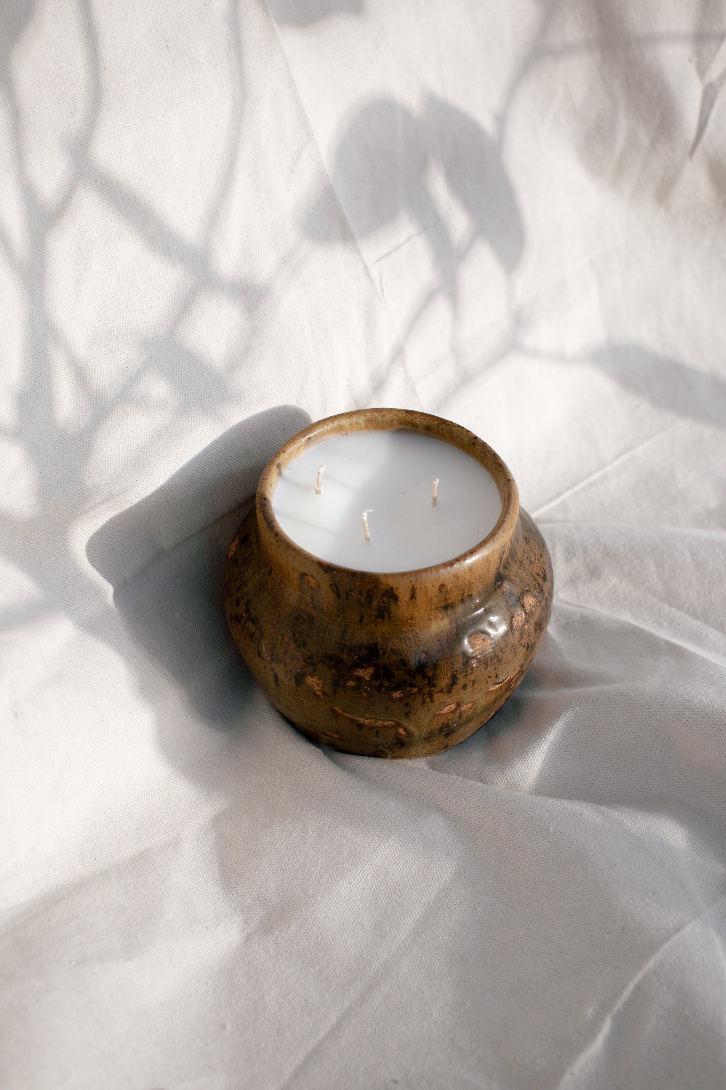 Vintage Handmade Ceramic Vase | H&G x Western Disco with white candle and natural textures. hommes + gardens estudio.