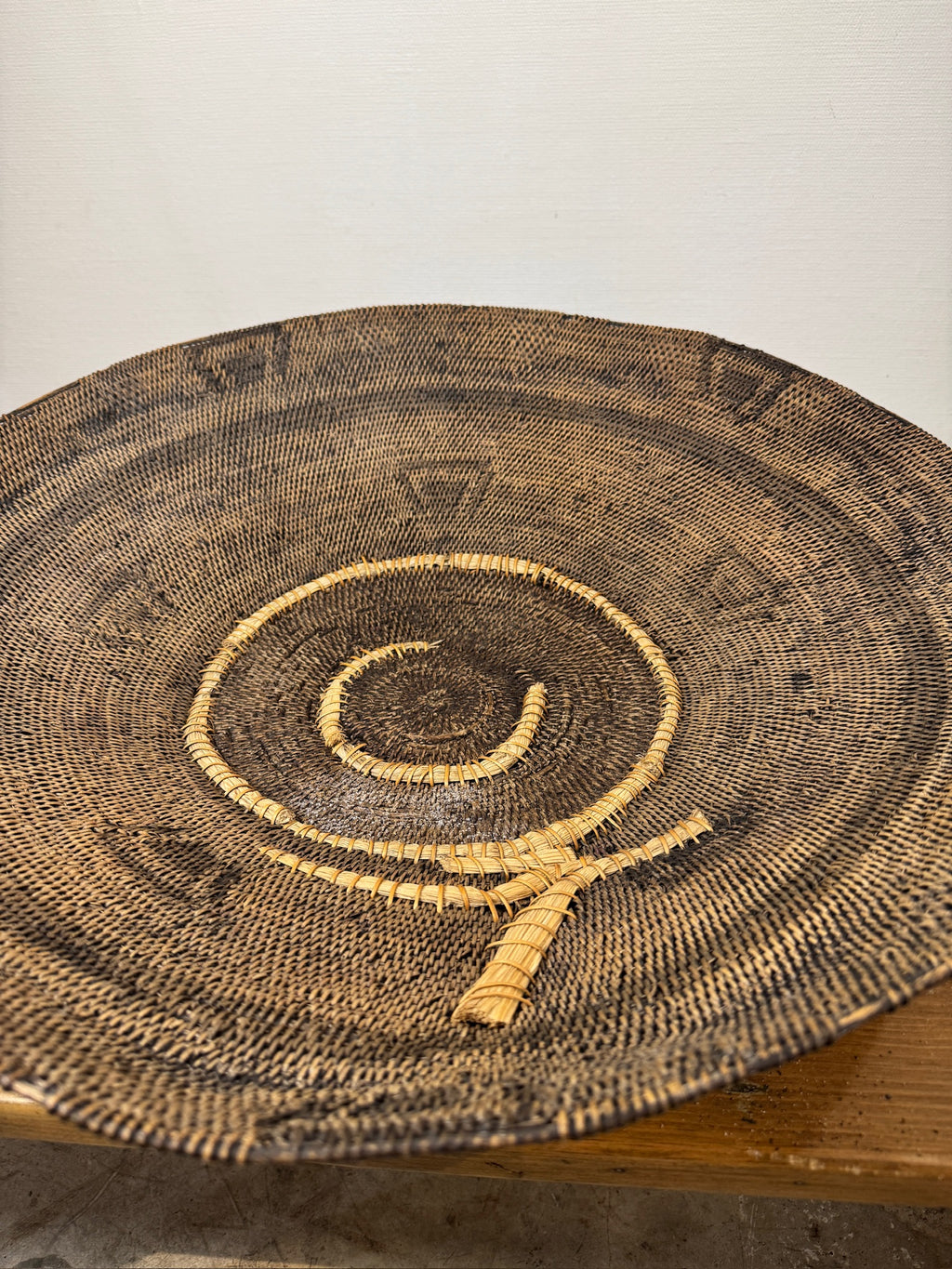 Rare Vintage Handwoven Basket with Organic Spiral & Tribal Motif on display, showcasing intricate weaving, hommes + gardens estudio.