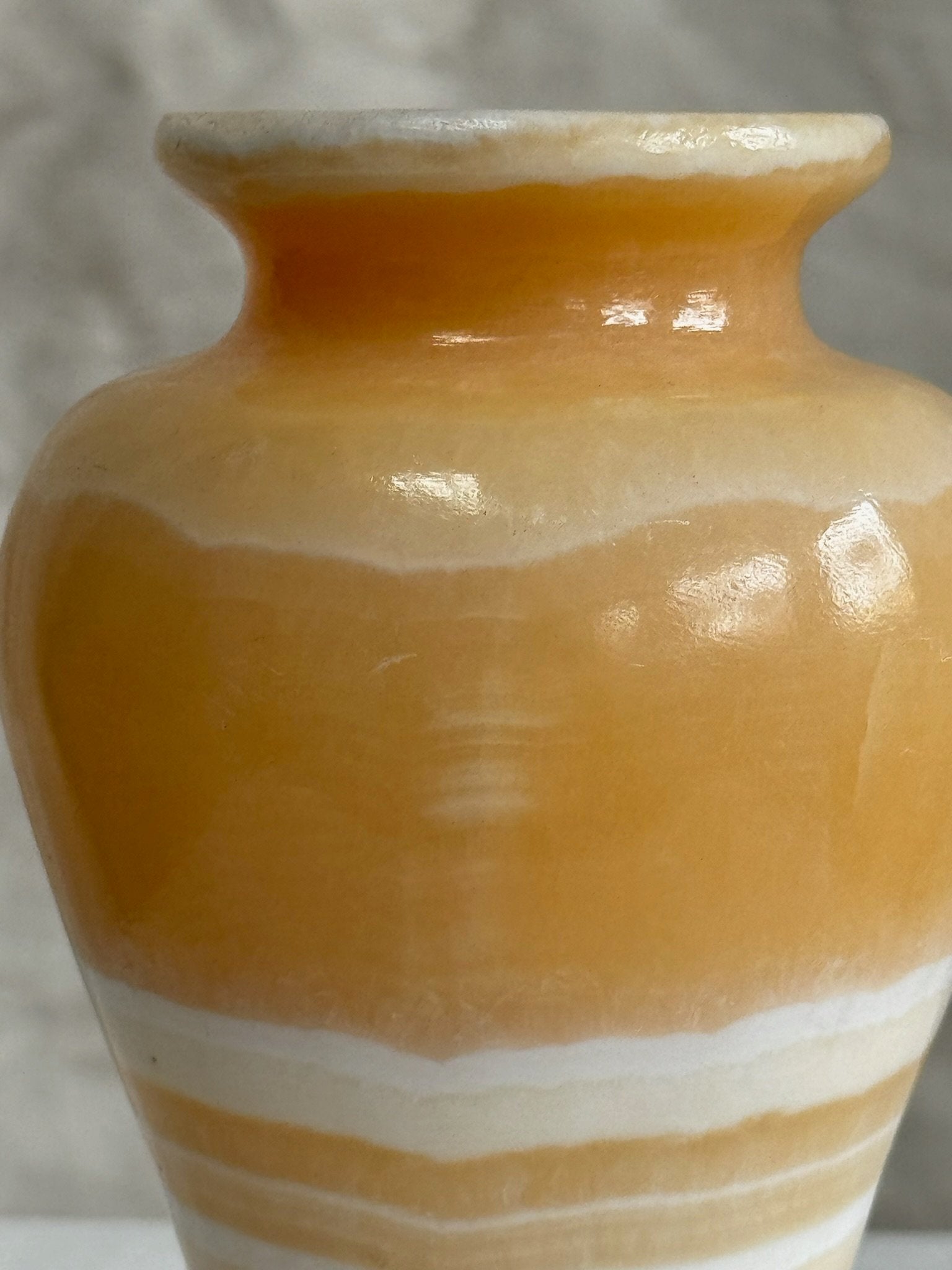 Close-up of Vintage Egyptian Onyx Marble Alabaster Stone Vase showcasing intricate patterns and honey beige tones. hommes + gardens estudio