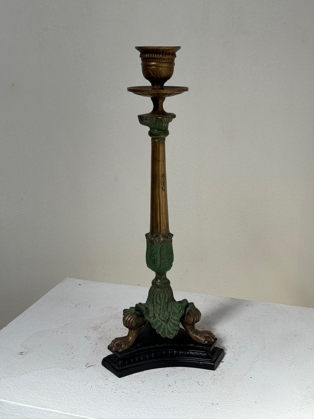 Midcentury Italian Brass/Bronze Candlesticks with claw feet and intricate details, adding vintage charm. hommes + gardens estudio