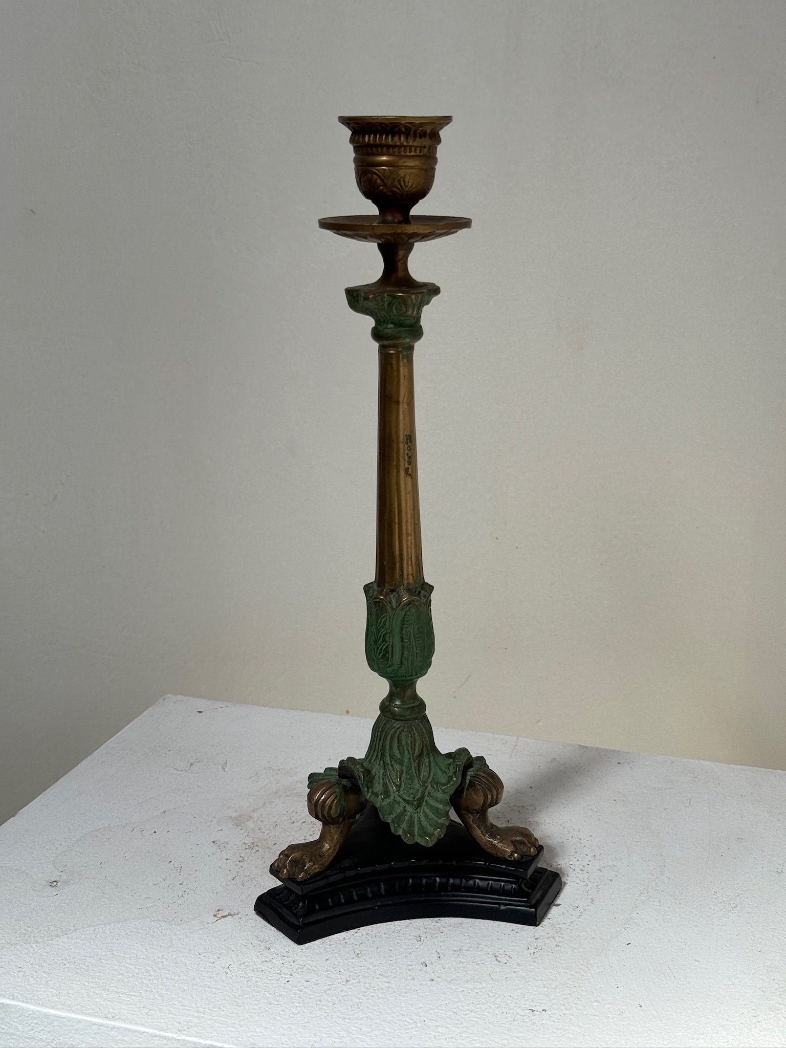 Midcentury Italian Brass/Bronze Candlesticks with claw feet and intricate details, adding vintage charm. hommes + gardens estudio