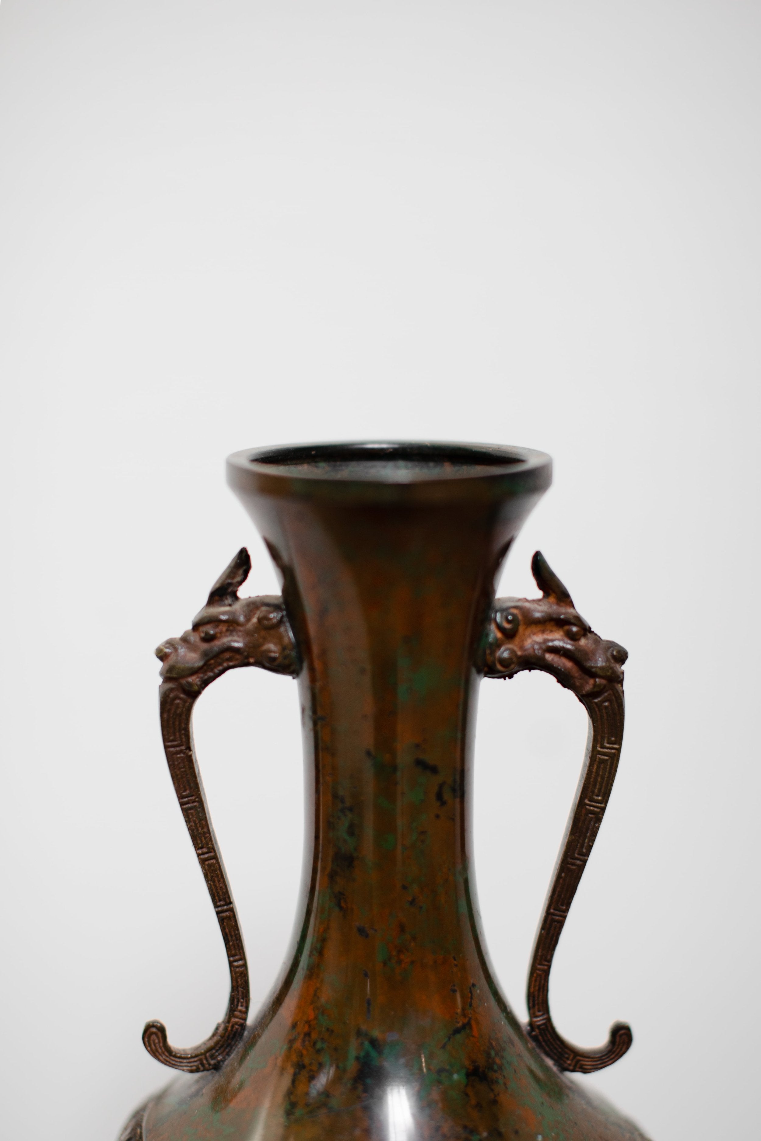 Vintage Japanese copper vase with engraved dragons and detailed dragon handles, rich patina showcasing exquisite craftsmanship — Hommes and Gardens, Pots + Vessels Collection, Landscape Architect, Interior Designer, Outdoor Living, Outdoor Decorations, Home Decor, Home Design, Luxury Design, Art, Furniture, Objects, Best Gifts, Nature, Backyard, Yard.