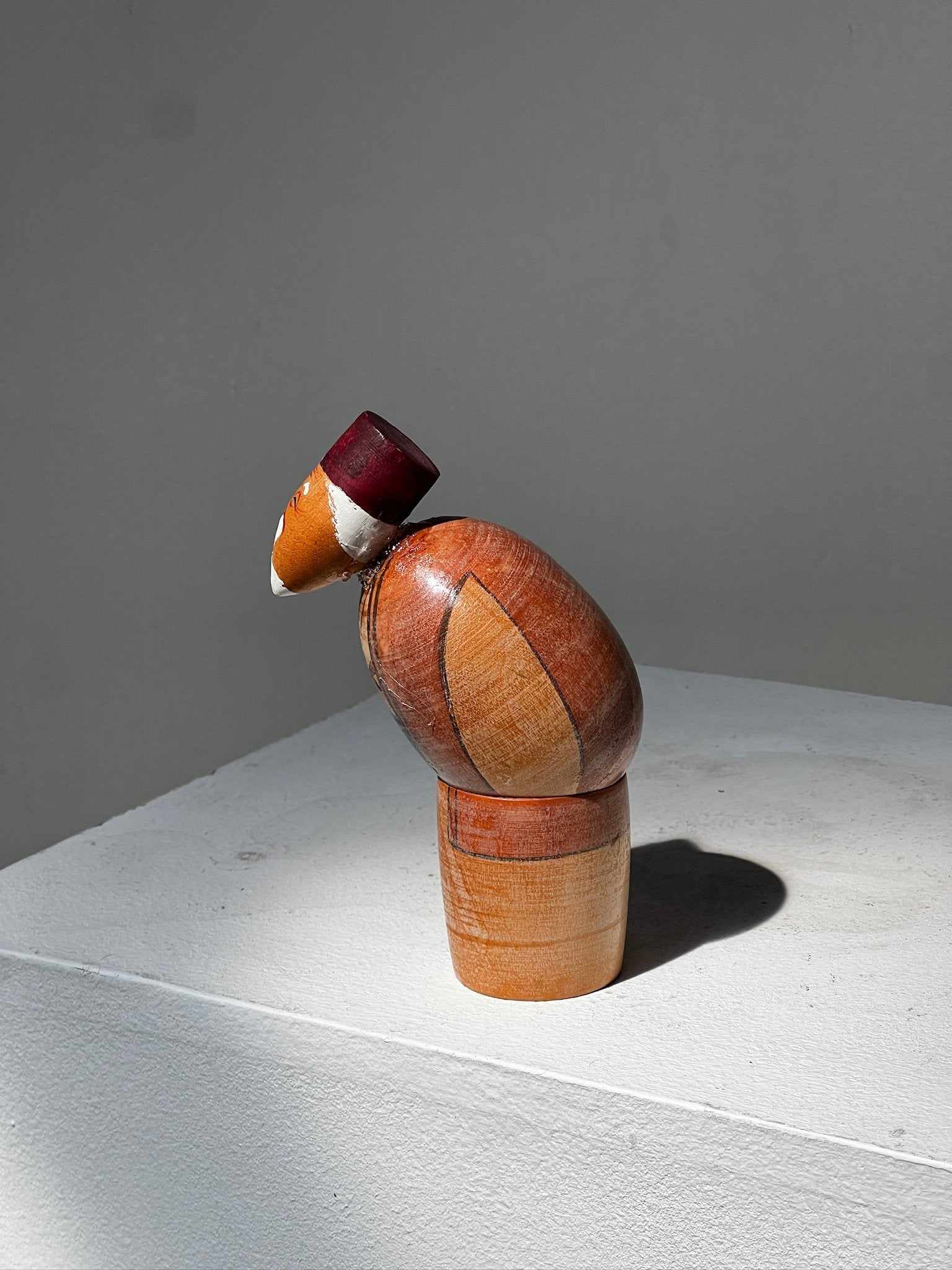 Vintage Takasago Kokeshi Japanese "Jō" Wood figurine displayed on a white surface, showcasing traditional craftsmanship. hommes + gardens estudio.