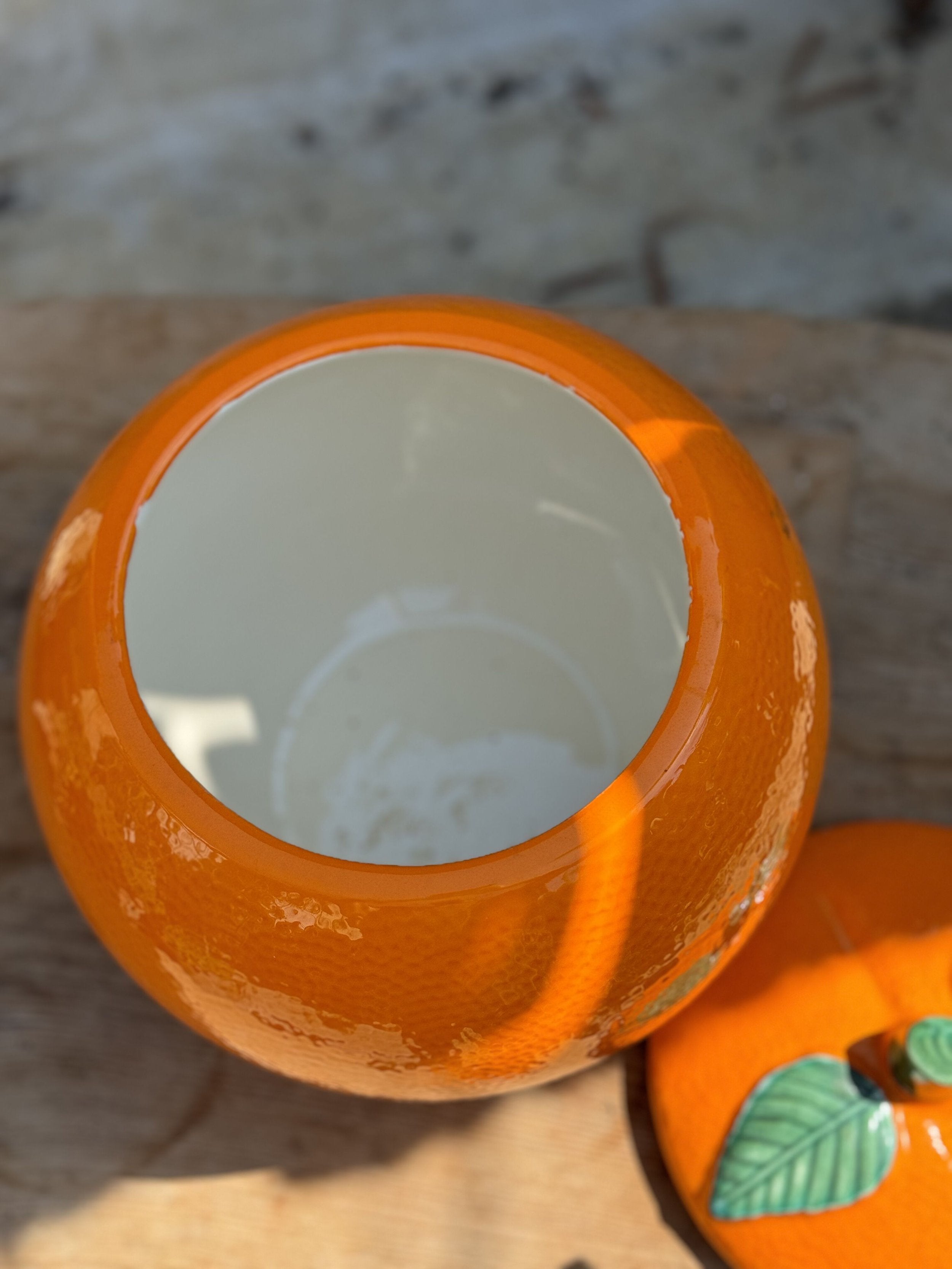 Interior view of the Retro Orange-Shaped Cookie Jar - Vintage Kitsch showcasing its vibrant color and design. hommes + gardens estudio.