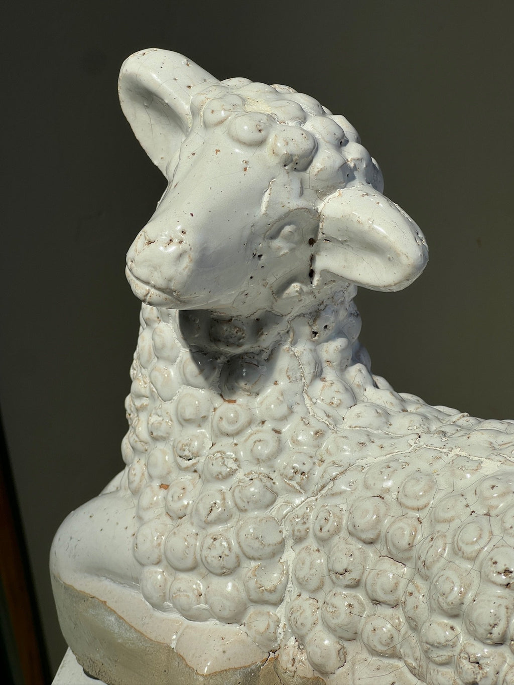 Vintage Laying Lamb Stoneware Figurine showcasing intricate details of a resting lamb sculpture. hommes + gardens estudio.