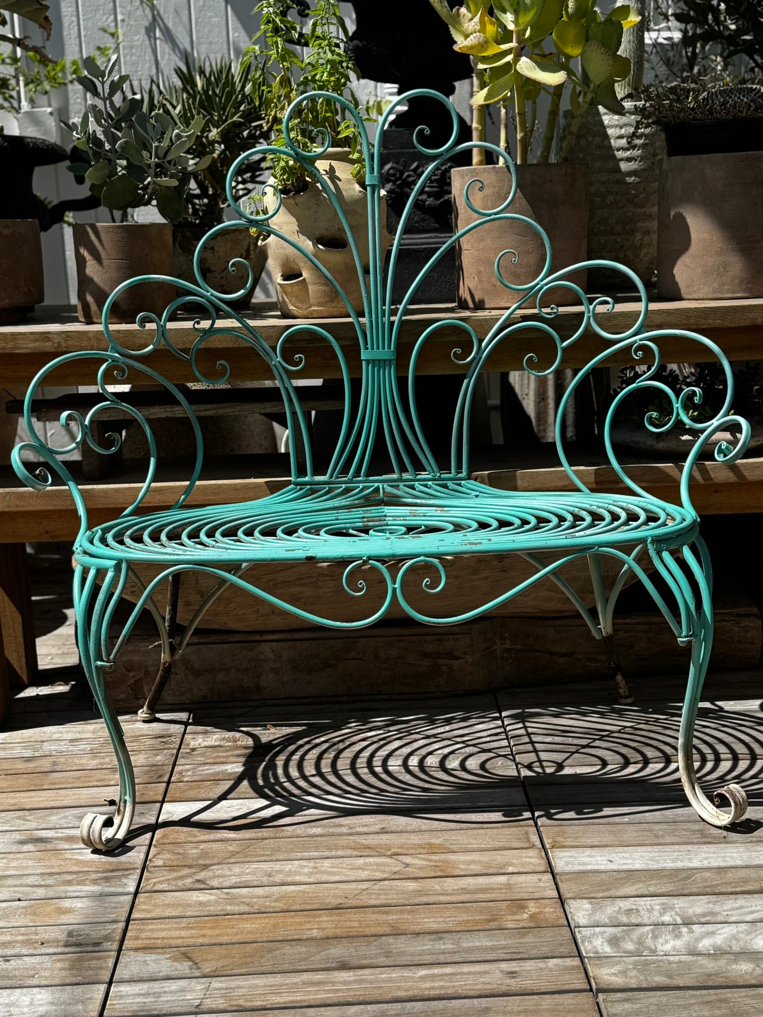 Whimsical Vintage Wrought Iron Peacock Garden Bench – Ornate Scrollwork displayed in a bright outdoor setting. hommes + gardens estudio.