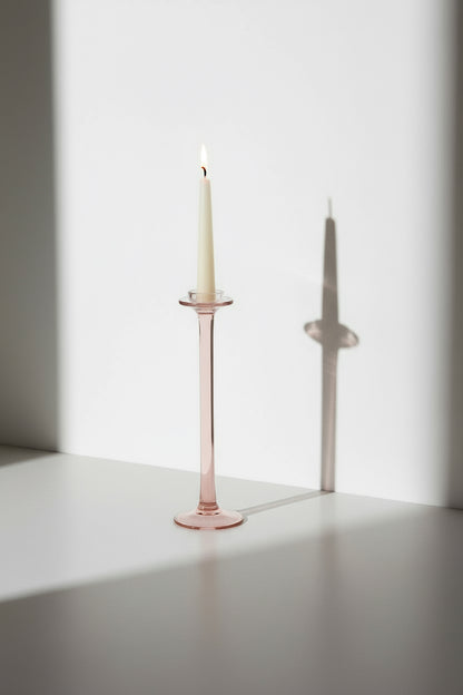Vintage pink glass candle holder with elegant tall design and soft rosy hue, a timeless accent piece adding warmth and charm to any interior — Hommes and Gardens, Candles Collection, Home Decor, Candle Holders, Vintage Glass Decor, Pink Candle Stand, Romantic Home Accent, Classic Lighting Accessory.