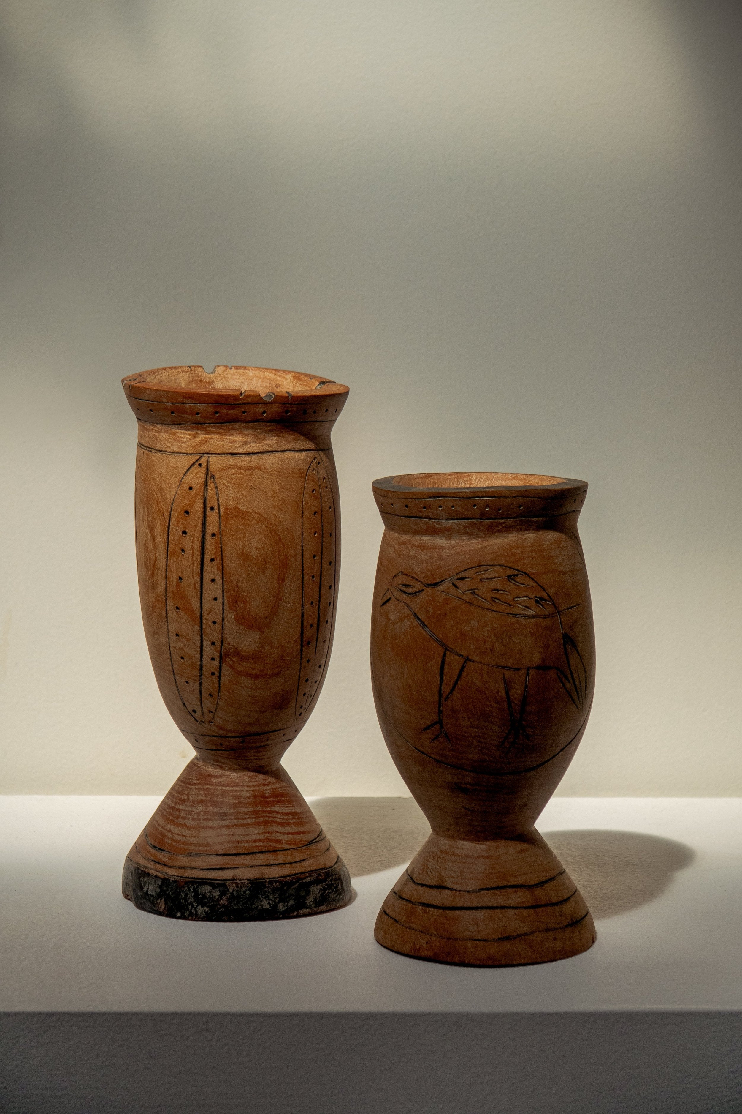 Pair of Vintage Wooden Goblets with Hand Carved Primitive Illustrations, showcasing unique engravings, hommes + gardens estudio.