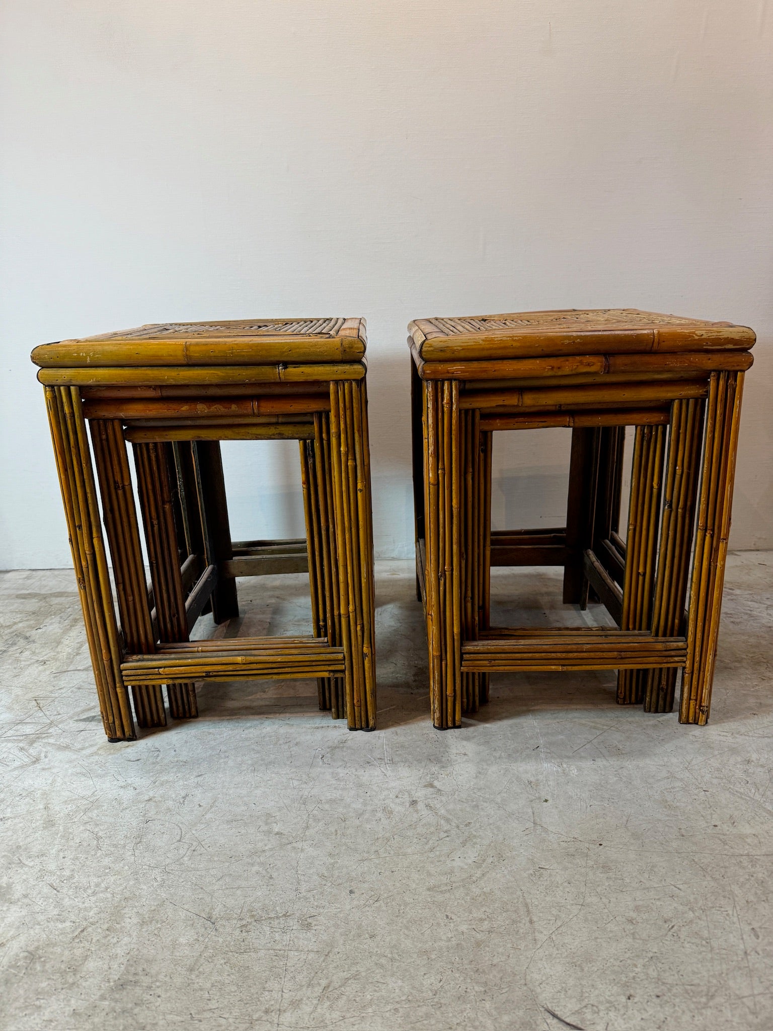 Vintage rattan and bamboo nesting tables with coastal boho aesthetic and rich brown tones, ideal for relaxed, natural interiors — Hommes and Gardens, Furniture Collection, Landscape Architect, Interior Designer, Outdoor Living, Art, Furniture, Objects, Best Gifts, Nature, Backyard, Yard, Outdoor Decorations, Home Decor, Home Design, Luxury Design.