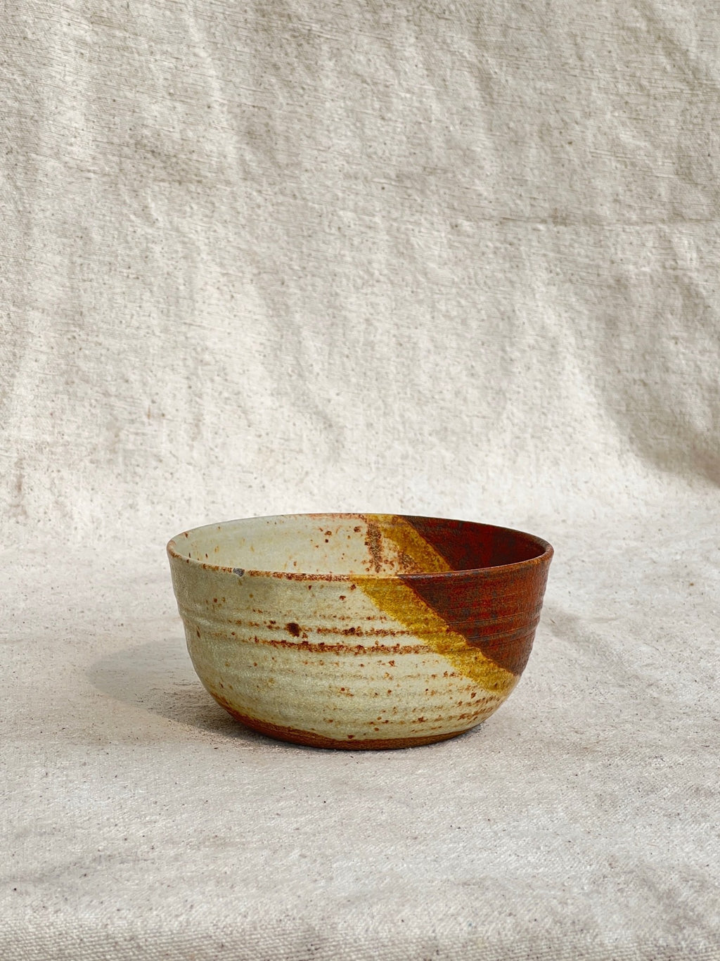 handmade rust glazed ceramic bowl textured finish detail
