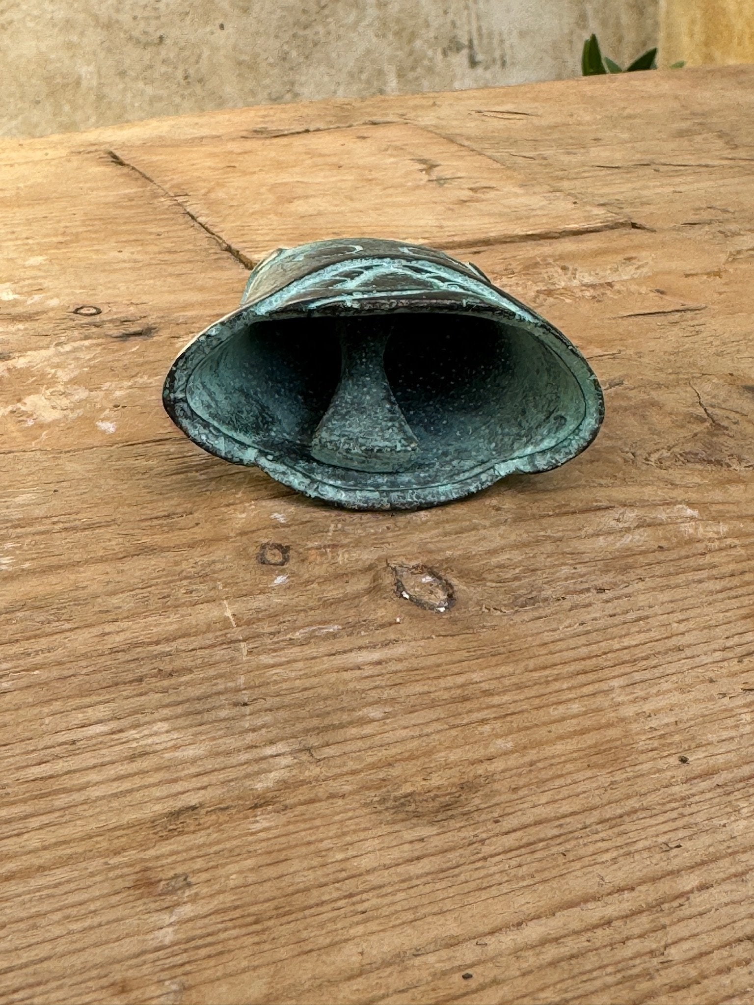 Shang Dynasty Bronze Bell showcasing intricate engravings and ancient craftsmanship. hommes + gardens estudio.