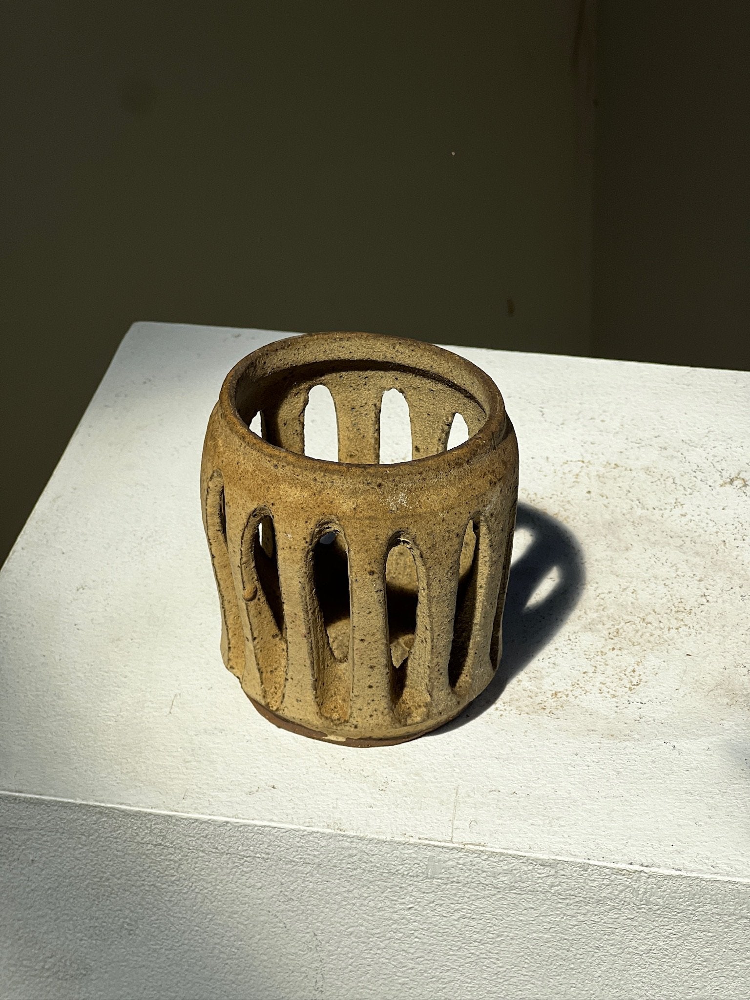 Slab pottery, lantern with organic openings showcasing earthy tones and natural charm. hommes + gardens estudio.